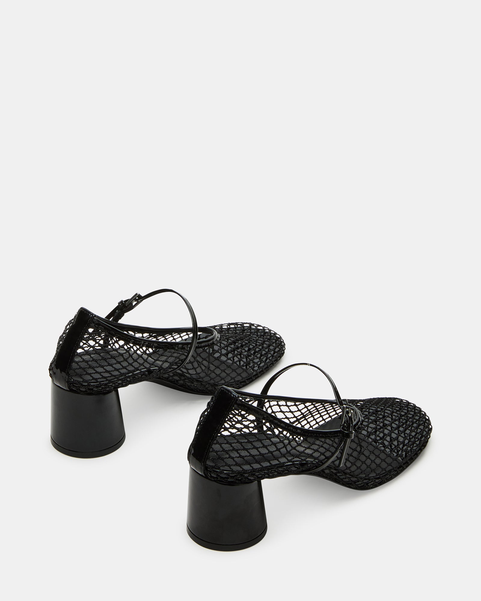Outfit pairing showing the Raynor Mary Jane high heels worn on a city street
