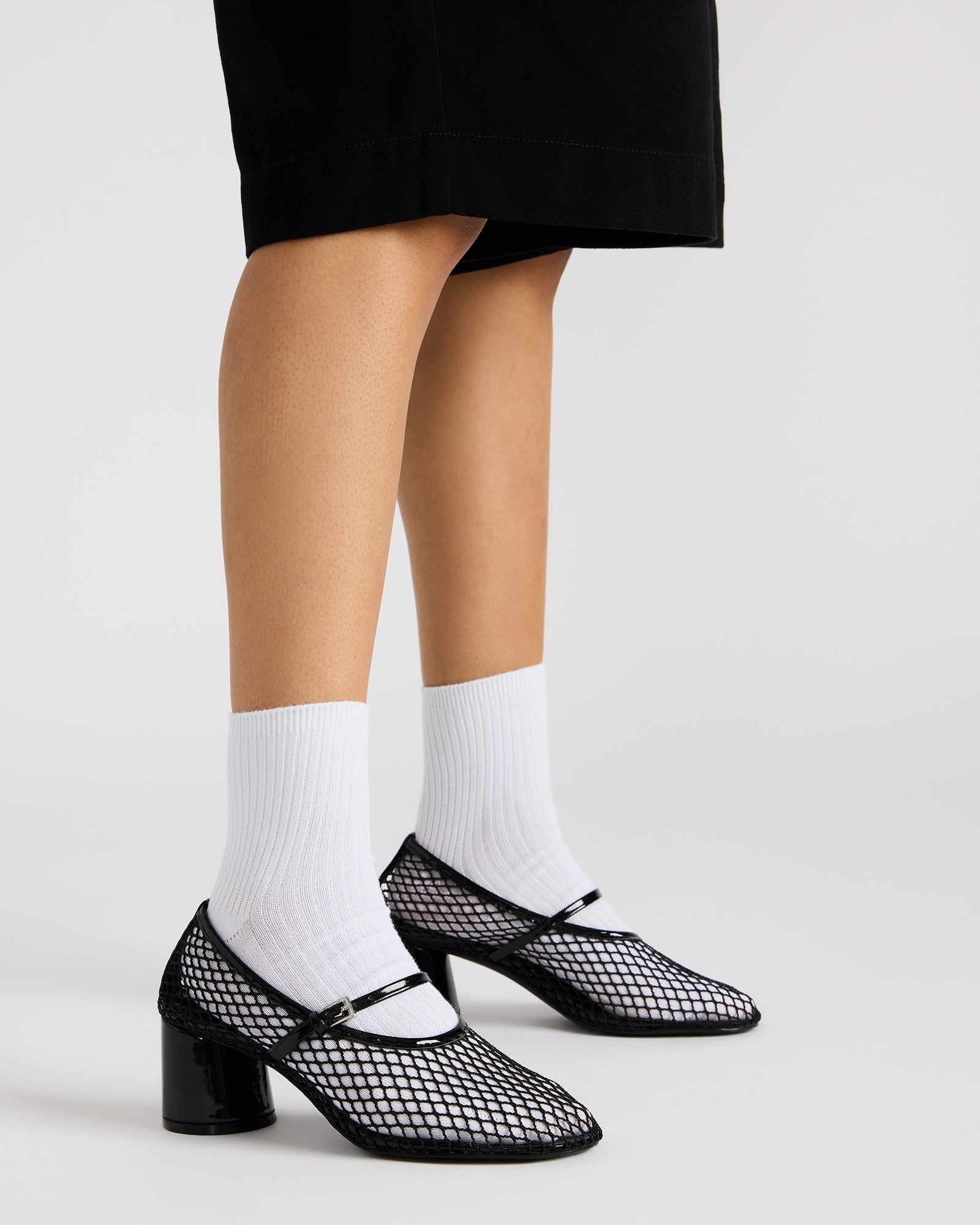 Close-up of the mesh design heels with comfortable lining and soft synthetic sock