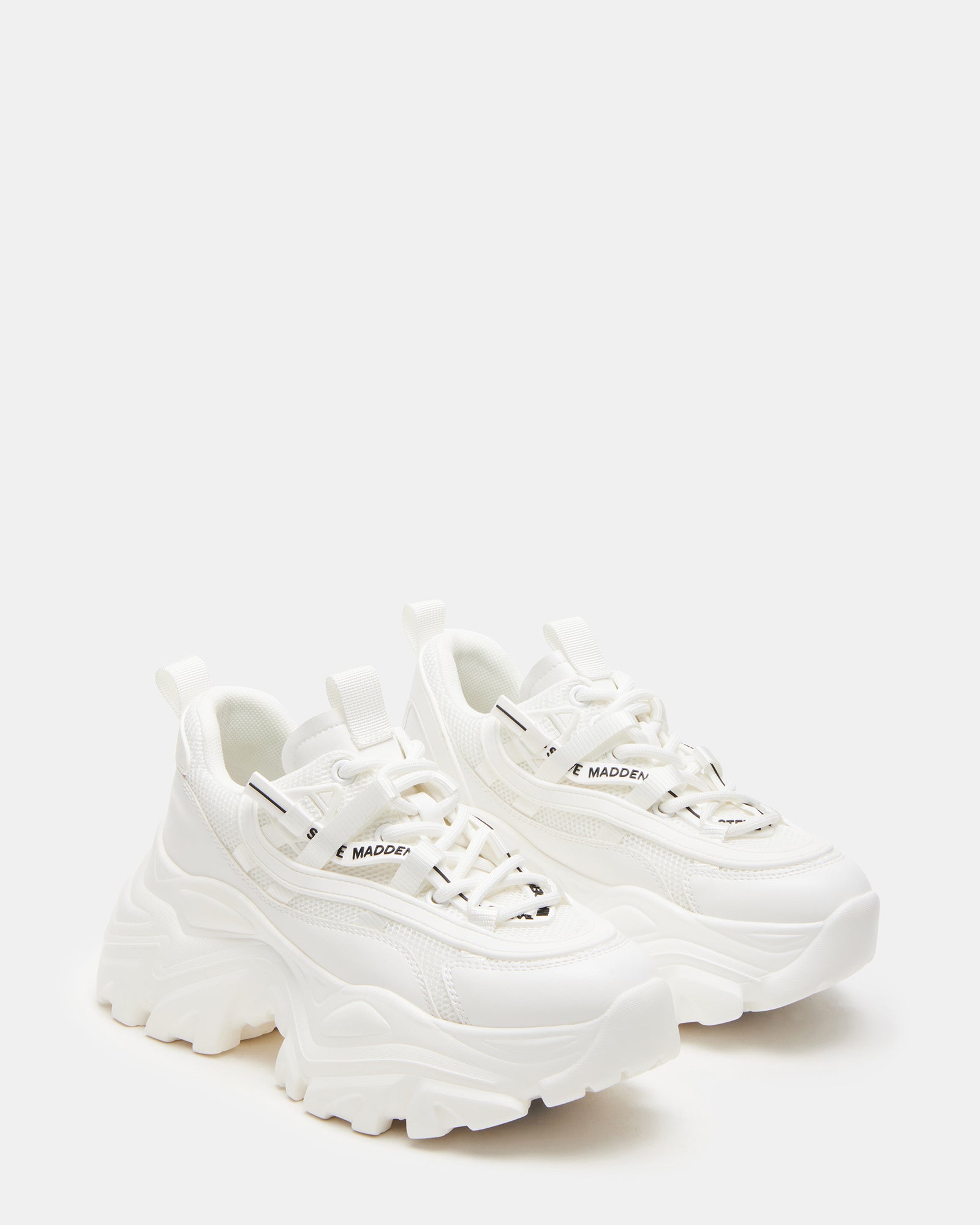 Close-up of the lace-up design of chunky white sneakers