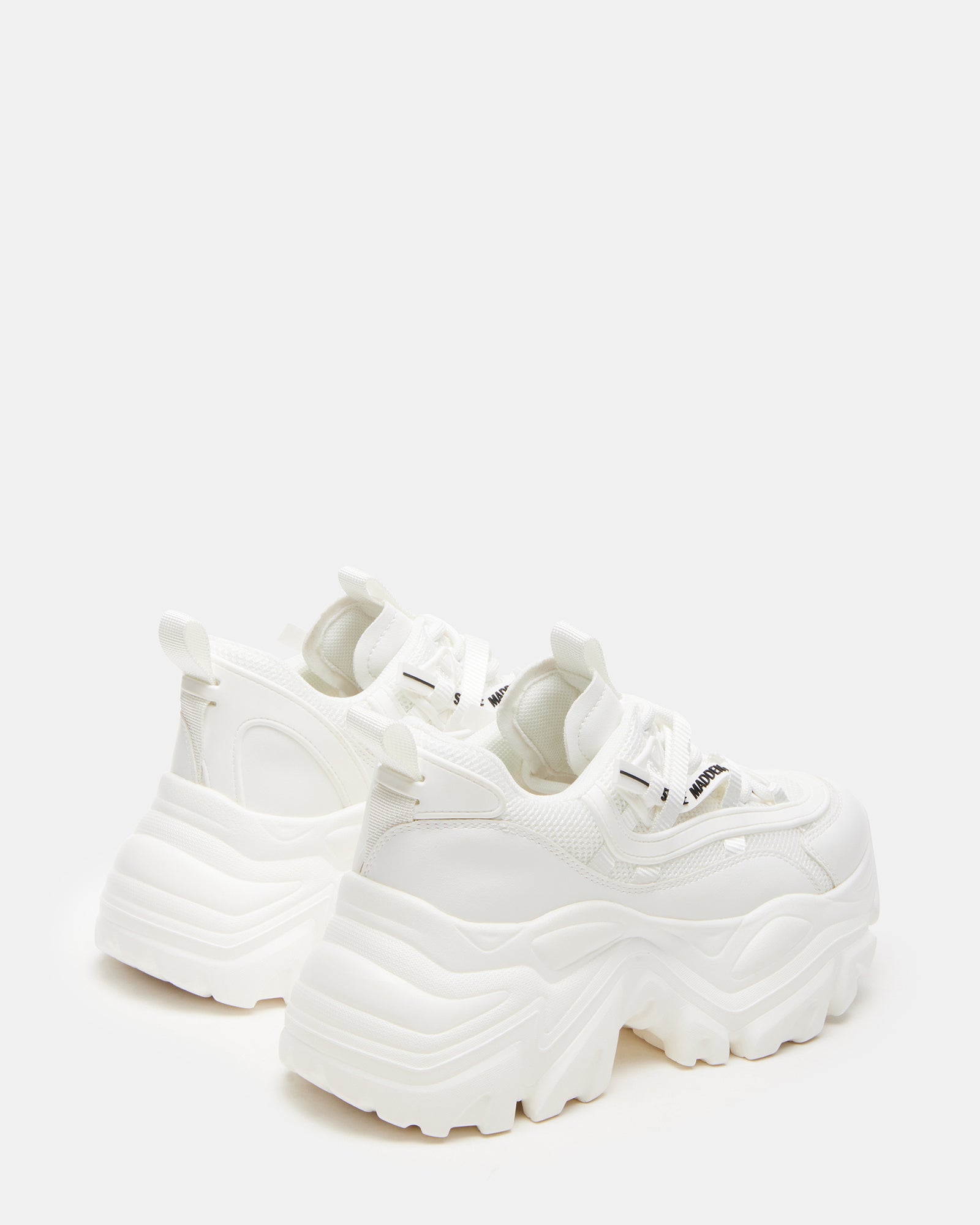 Close-up of the lace-up design of chunky white sneakers