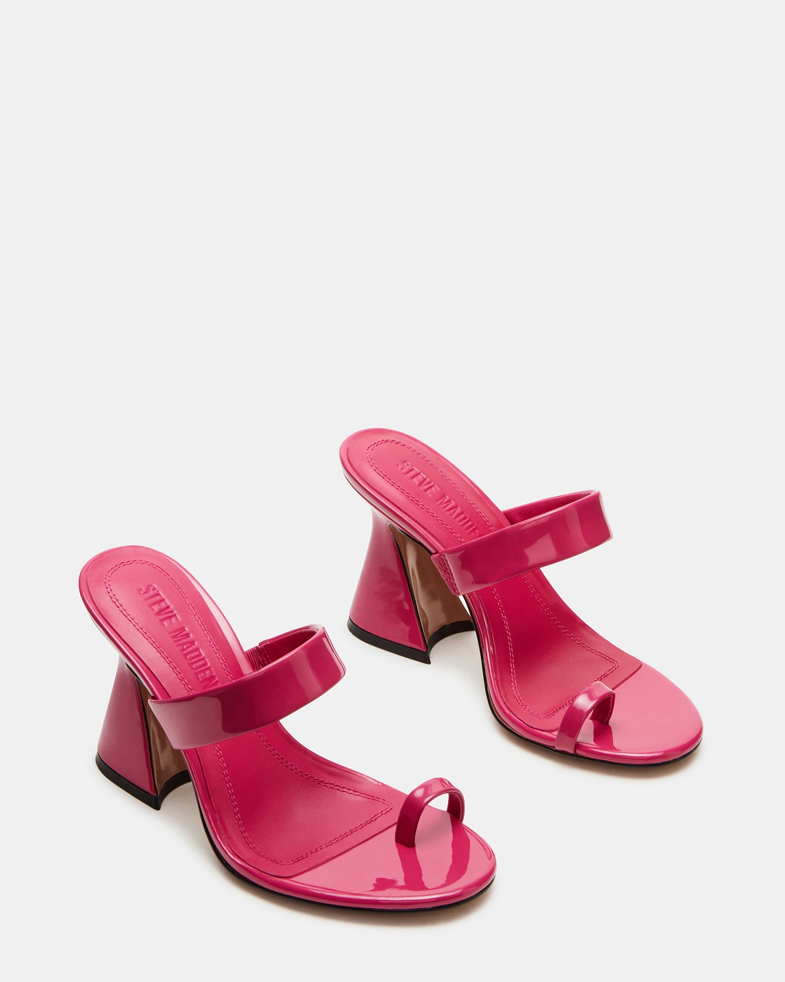 Close-up of kitten heel mules shoes emphasizing the leather sock lining and rounded toe