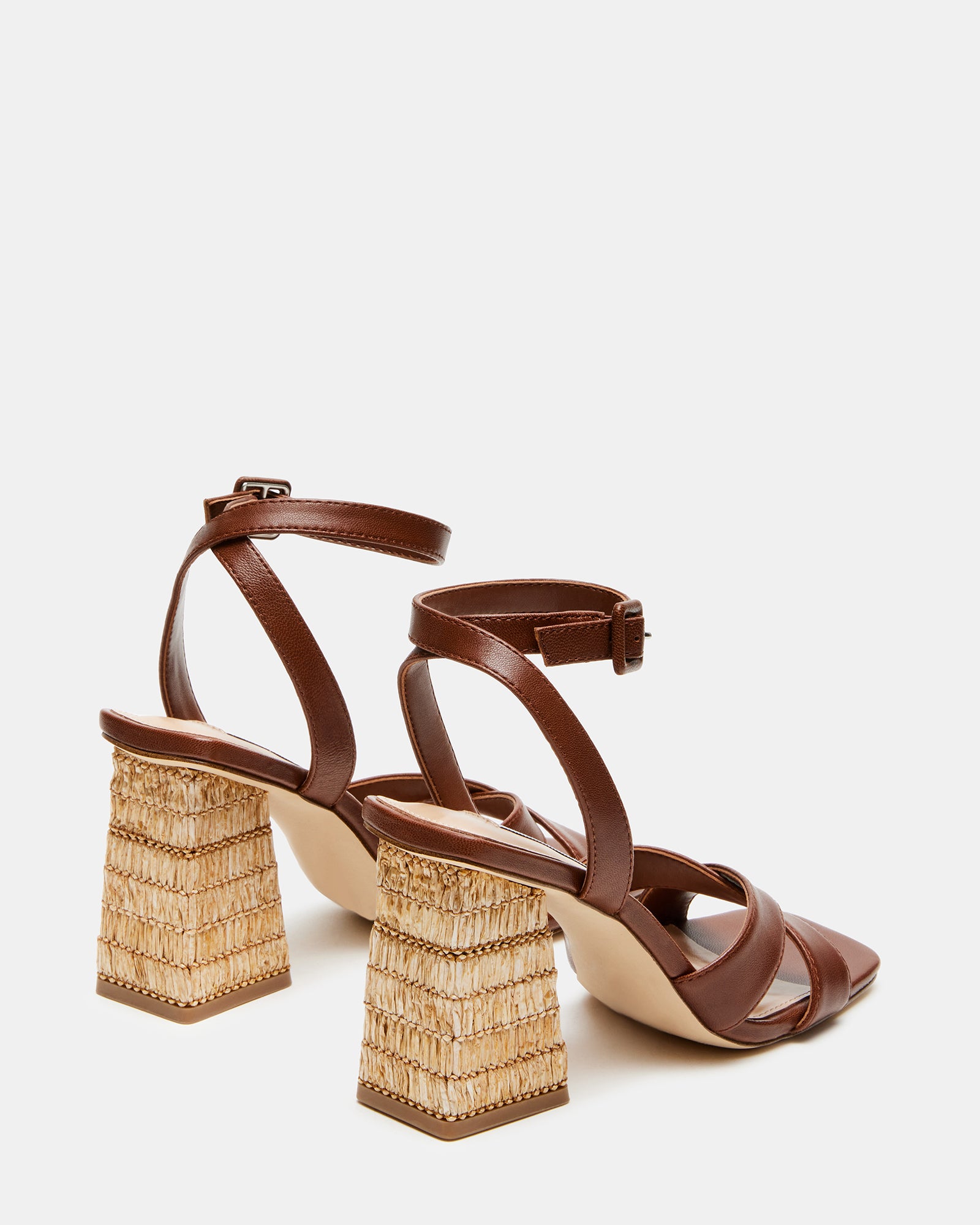 Model wearing Renley brown leather block heel sandals in a summer outfit.