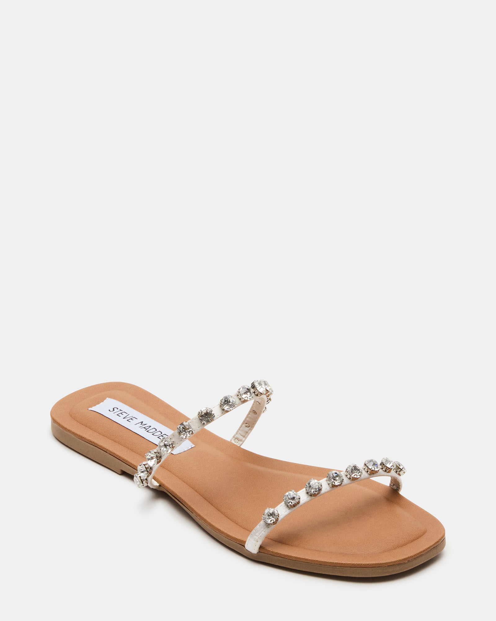 Model wearing Glamour Retreat square toe sandals at a summer event.