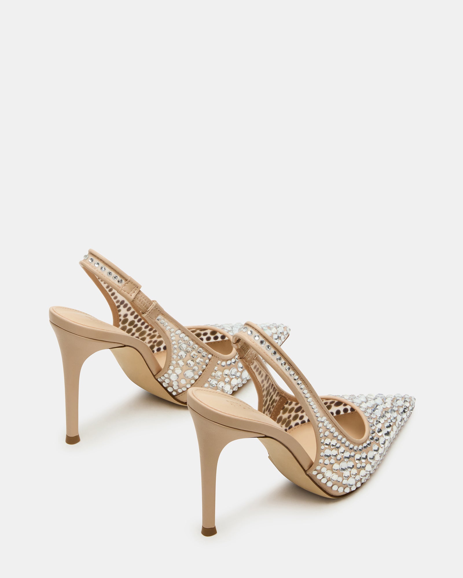Full view of black pumps with rhinestones styled with a dress