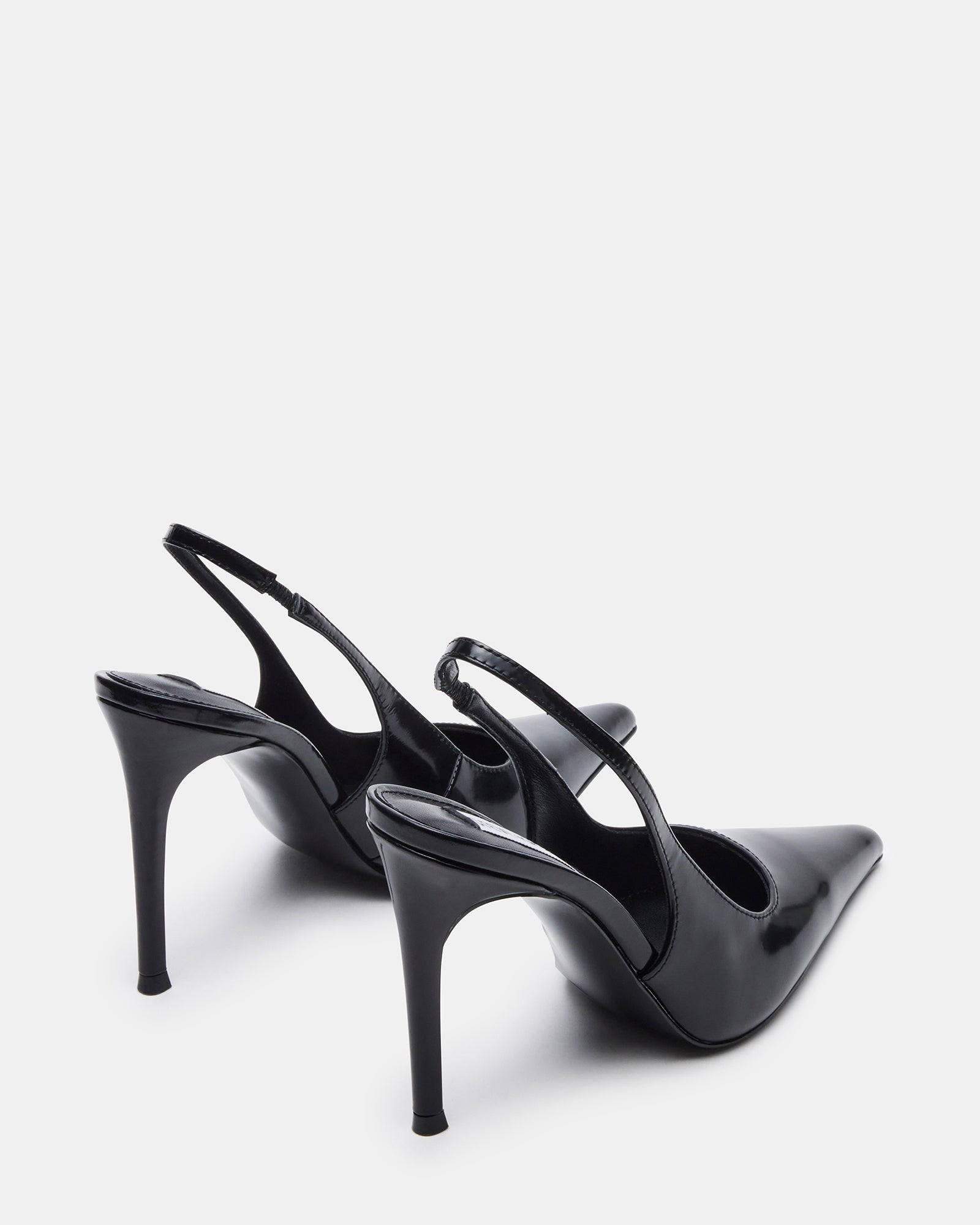Reyes pointed toe black high heels styled with a cocktail dress
