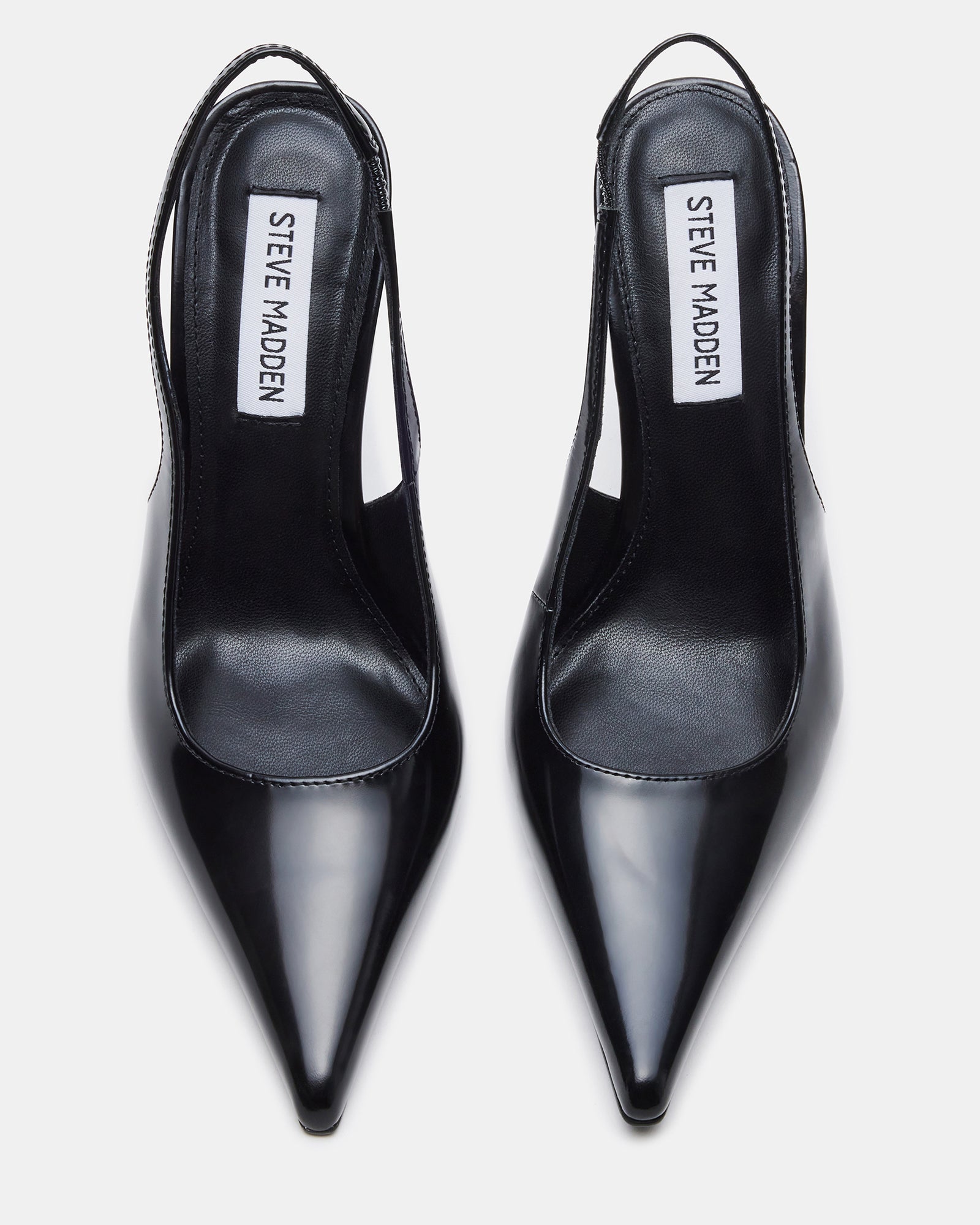 Rear view showing slingback pumps strap and heel height on marble flooring