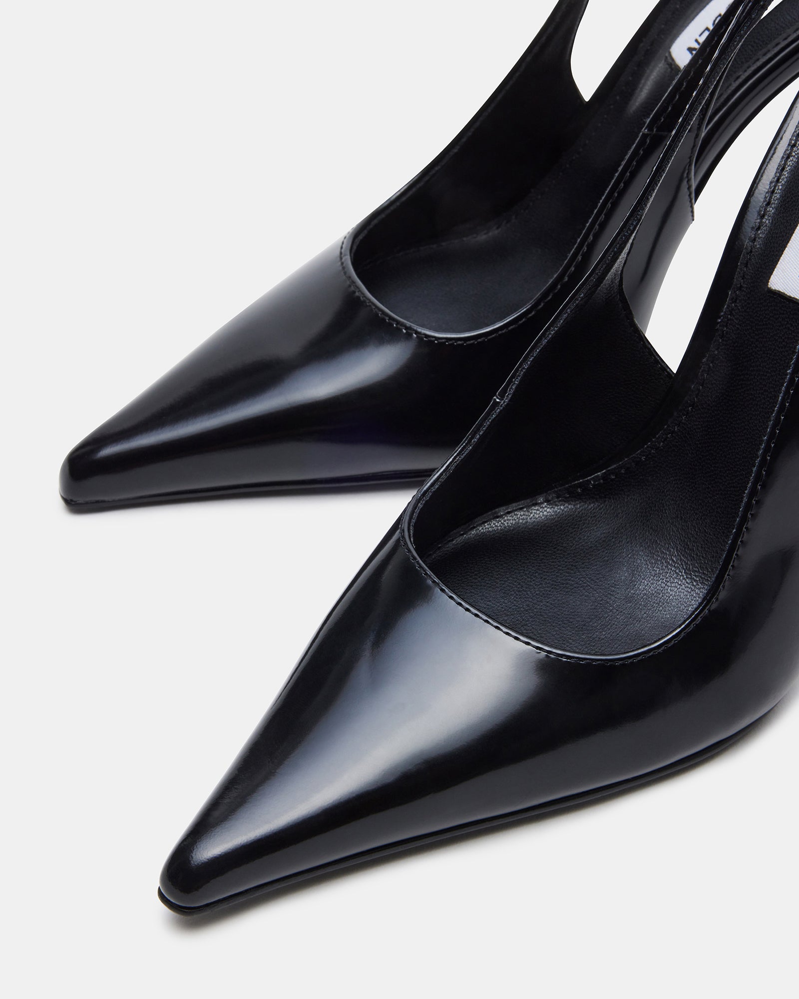Side angle of black stiletto heels with pointed toe for formal wear