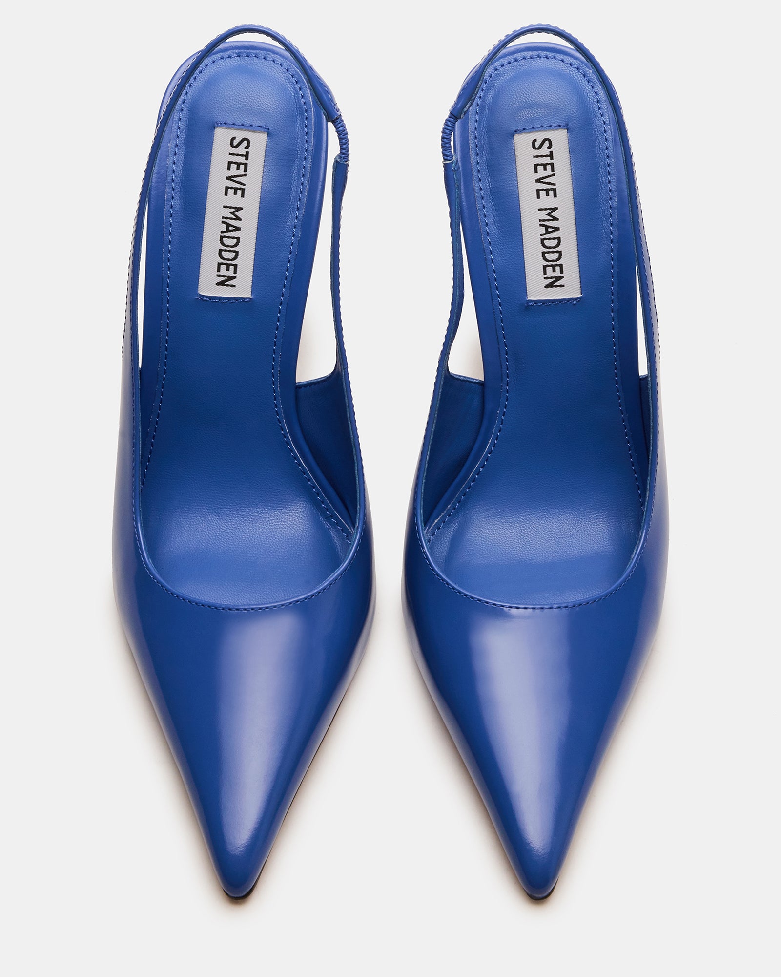Close-up of Reyes dark blue patent leather pumps showing pointed toe and stiletto heel