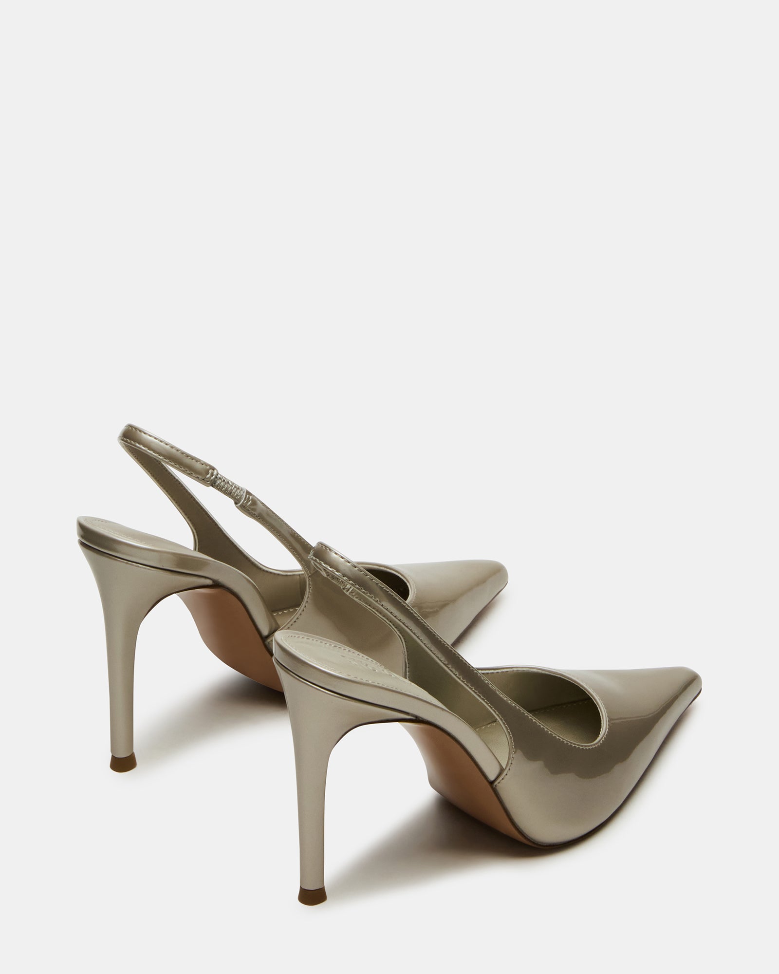 Close-up of the stylish synthetic upper of Reyes Champagne slingback pumps.