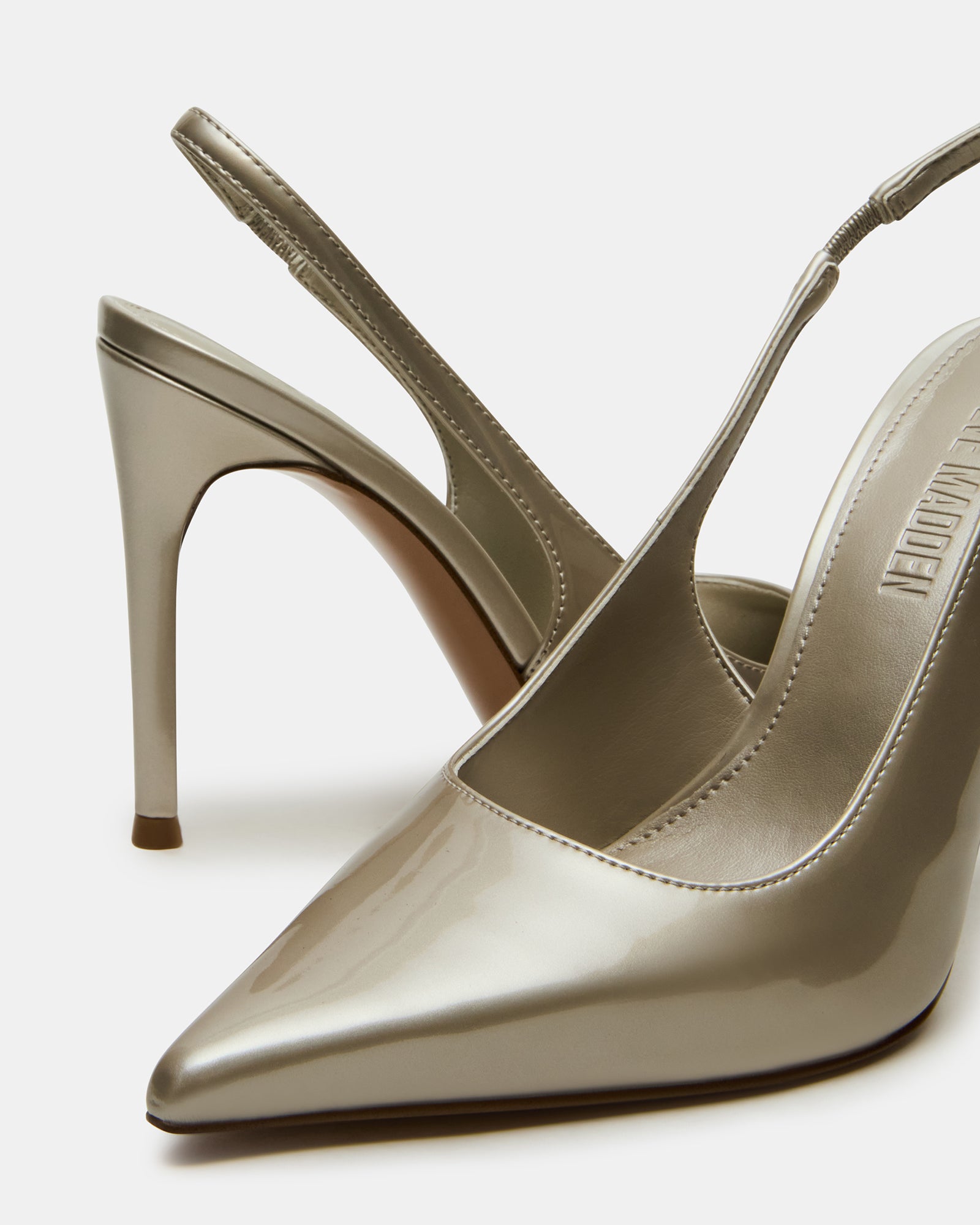 Model wearing Reyes Champagne slingback pumps at an evening event.