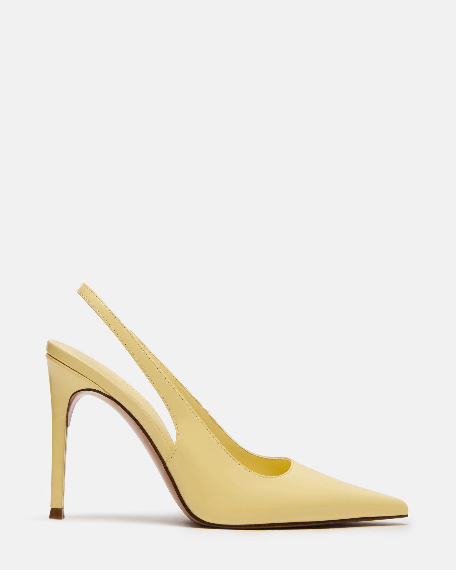 REYES white slingback heels styled with a black cocktail dress