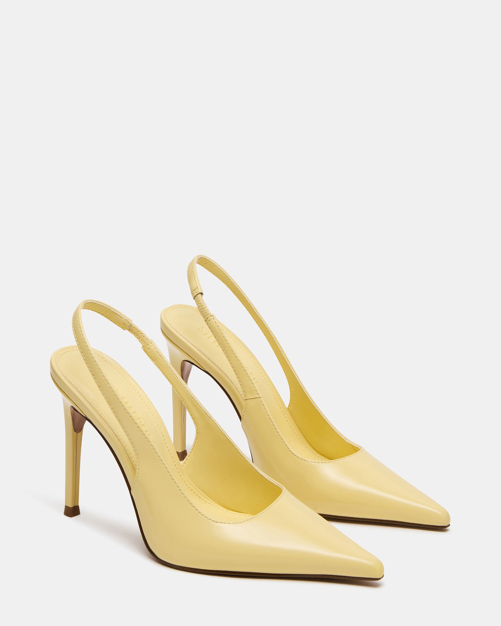 Close-up of pointed toe and leather texture on REYES pumps