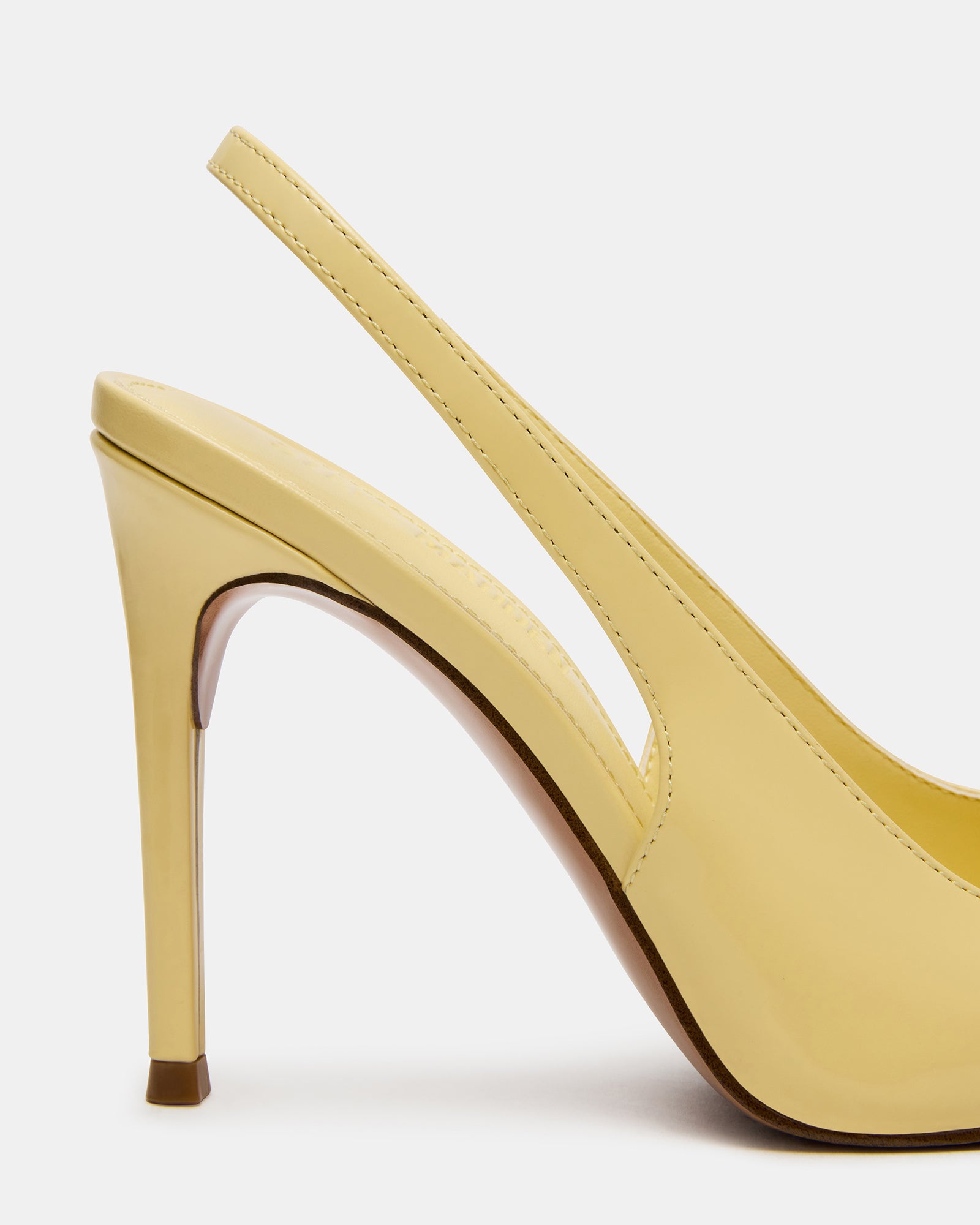 Silver slingback heels paired with evening clutch for formal events