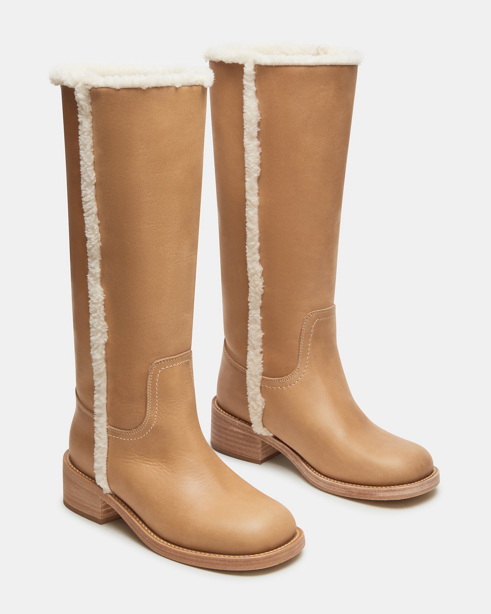 Side profile of black leather boots with square toe design