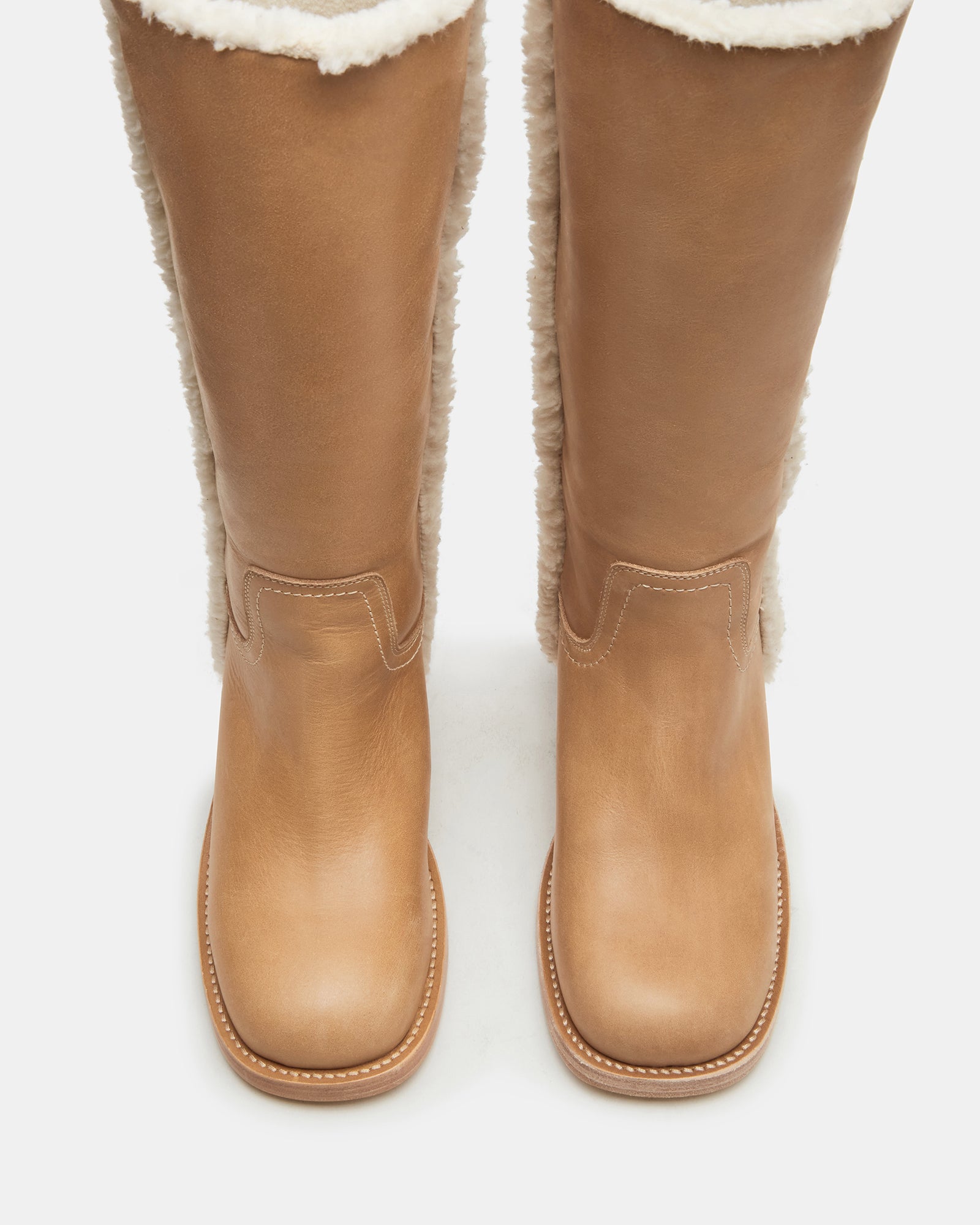 Close-up of faux fur lining inside wide calf knee high boots