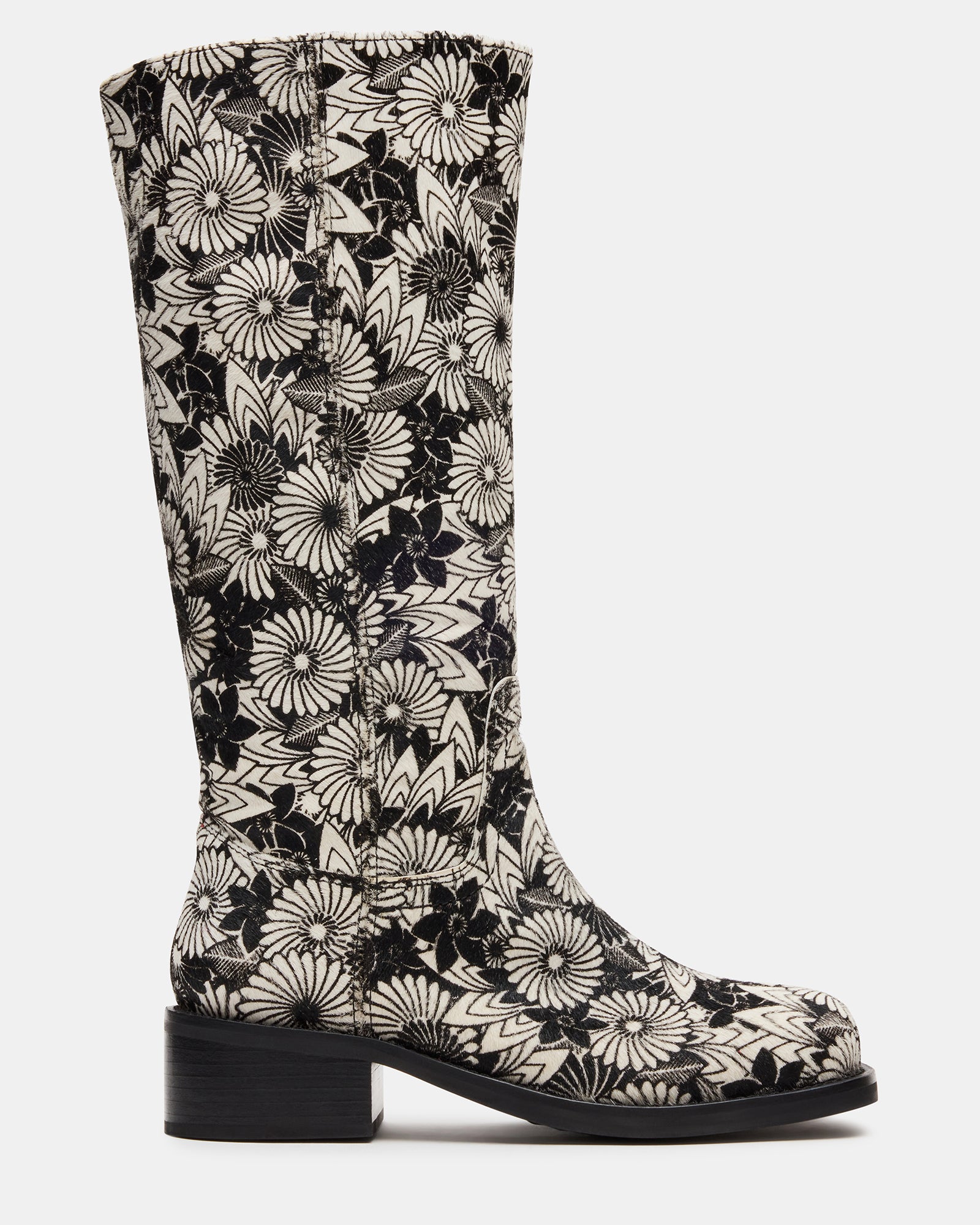 Riggs Black Multi knee-high boots paired with jeans for a chic urban look.