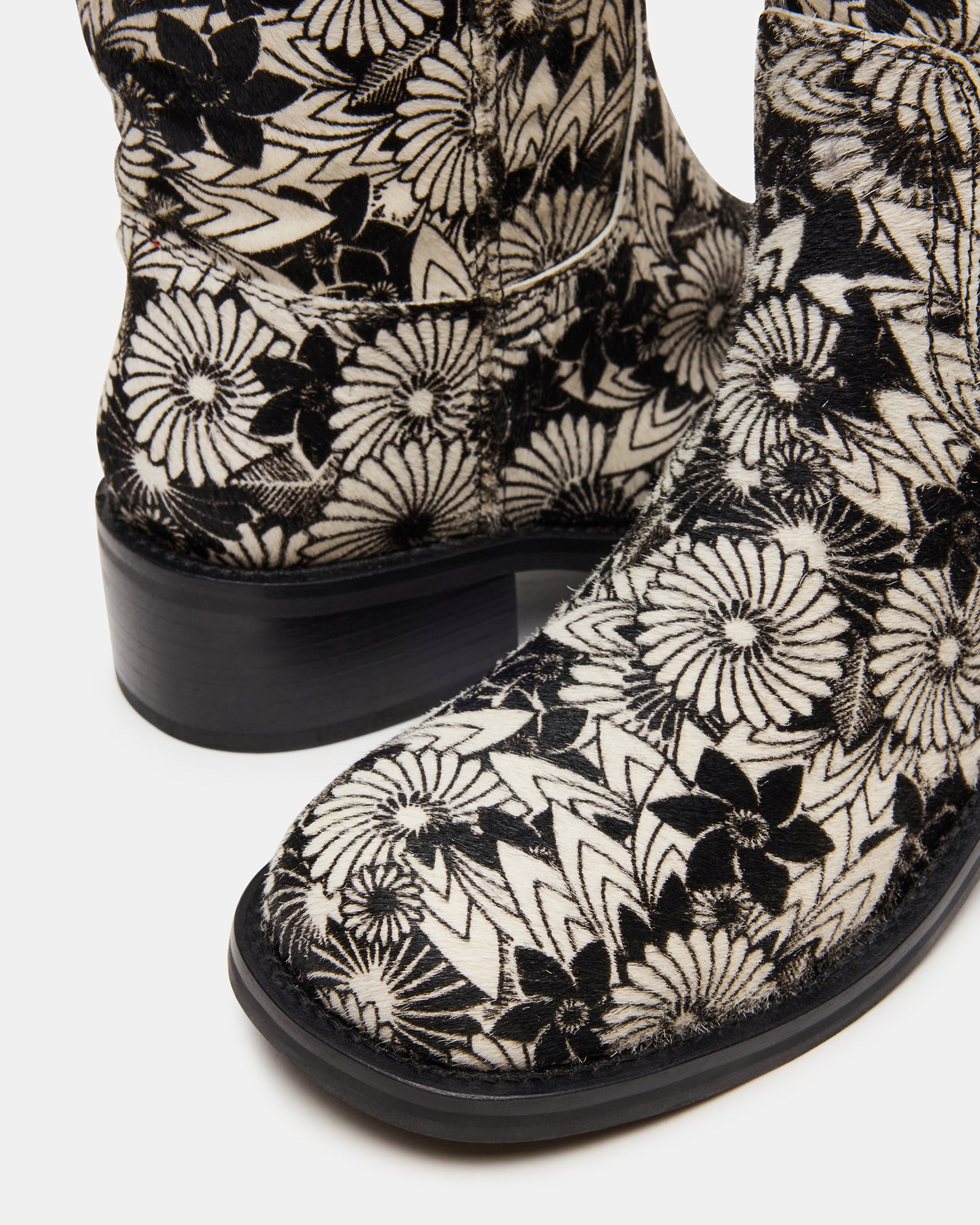 Side profile showing the sleek design of these brown leather boots.