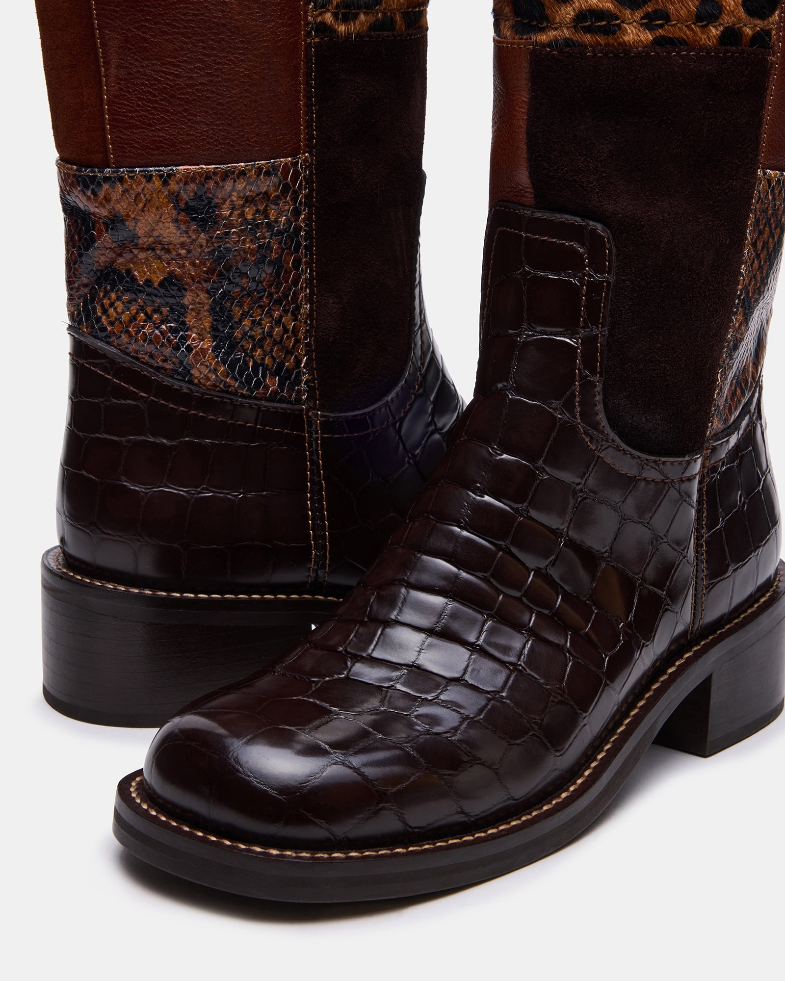 Close-up of heel and stitching on Riggs brown leather boots highlighting craftsmanship