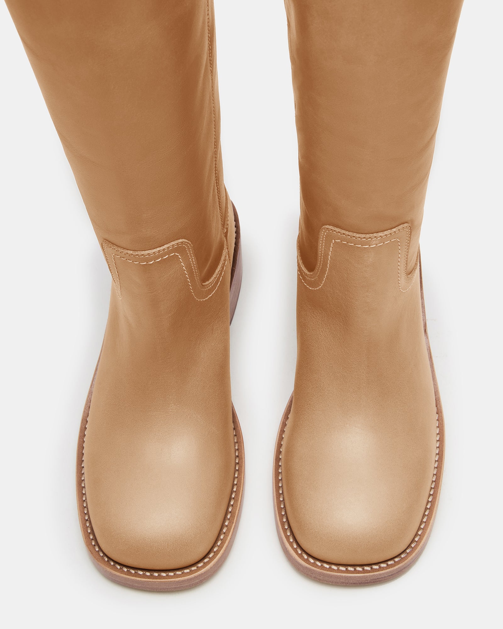 Close-up of the wide calf leather boots showing detailed stitching and leather texture