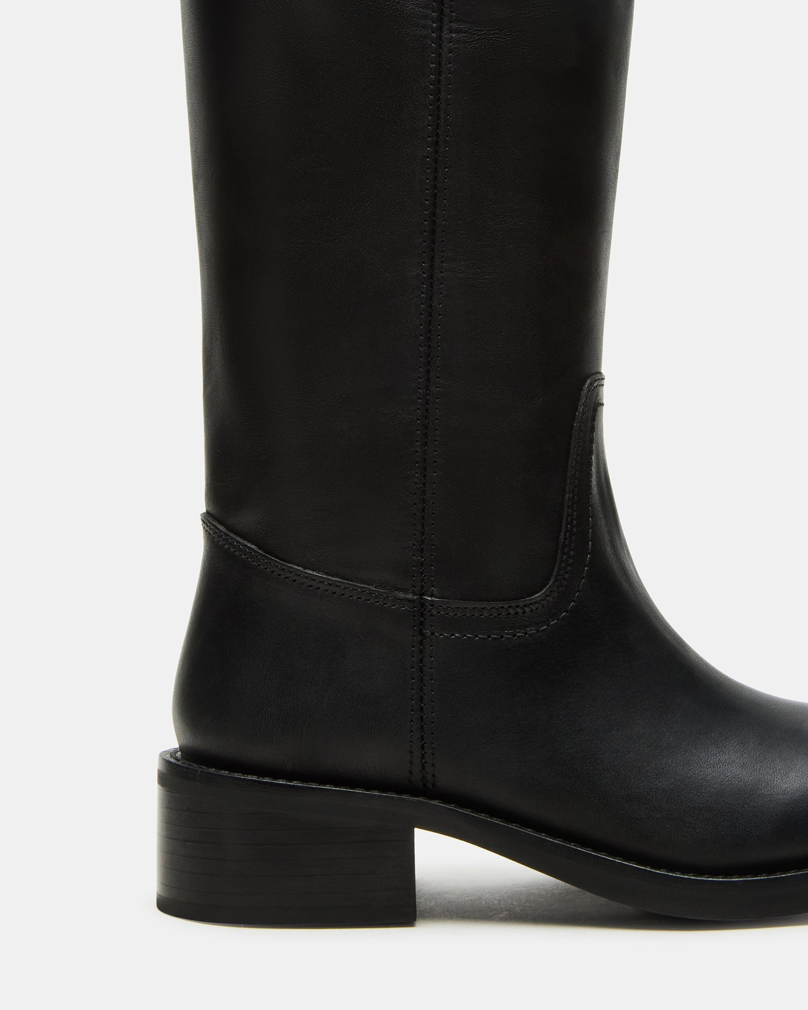 Side view of black leather wide calf boots with square-toe design