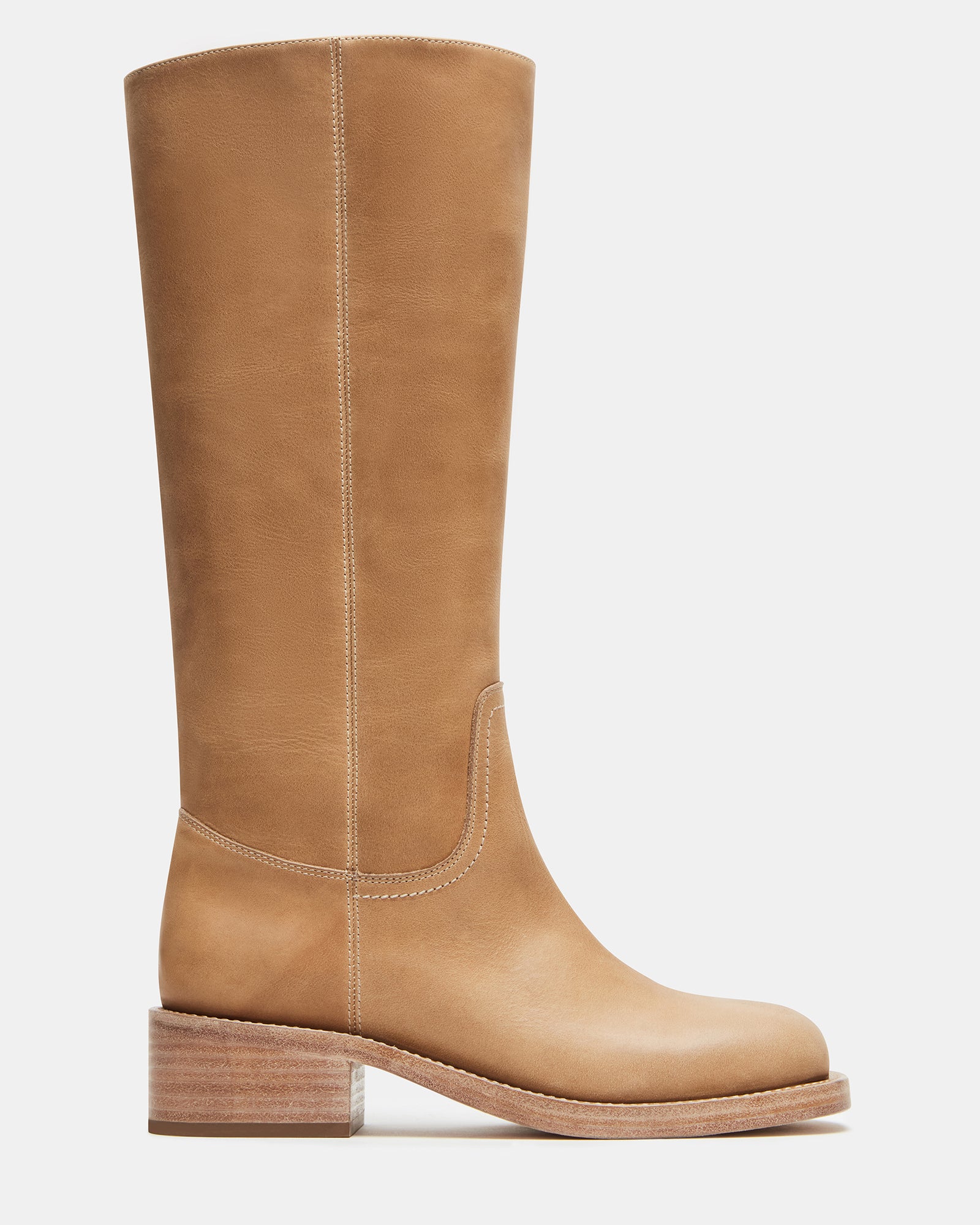 Side profile of leather boots worn in downtown setting