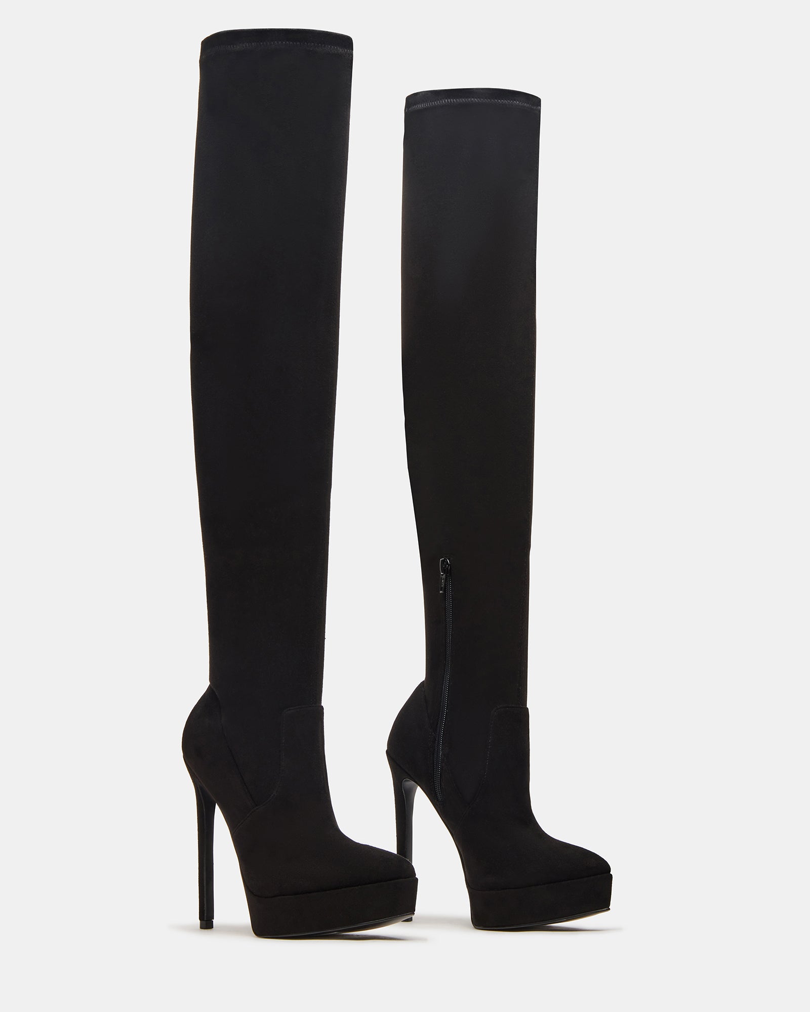 Close-up view of the pointed toe cowboy boots on a stylish outfit.