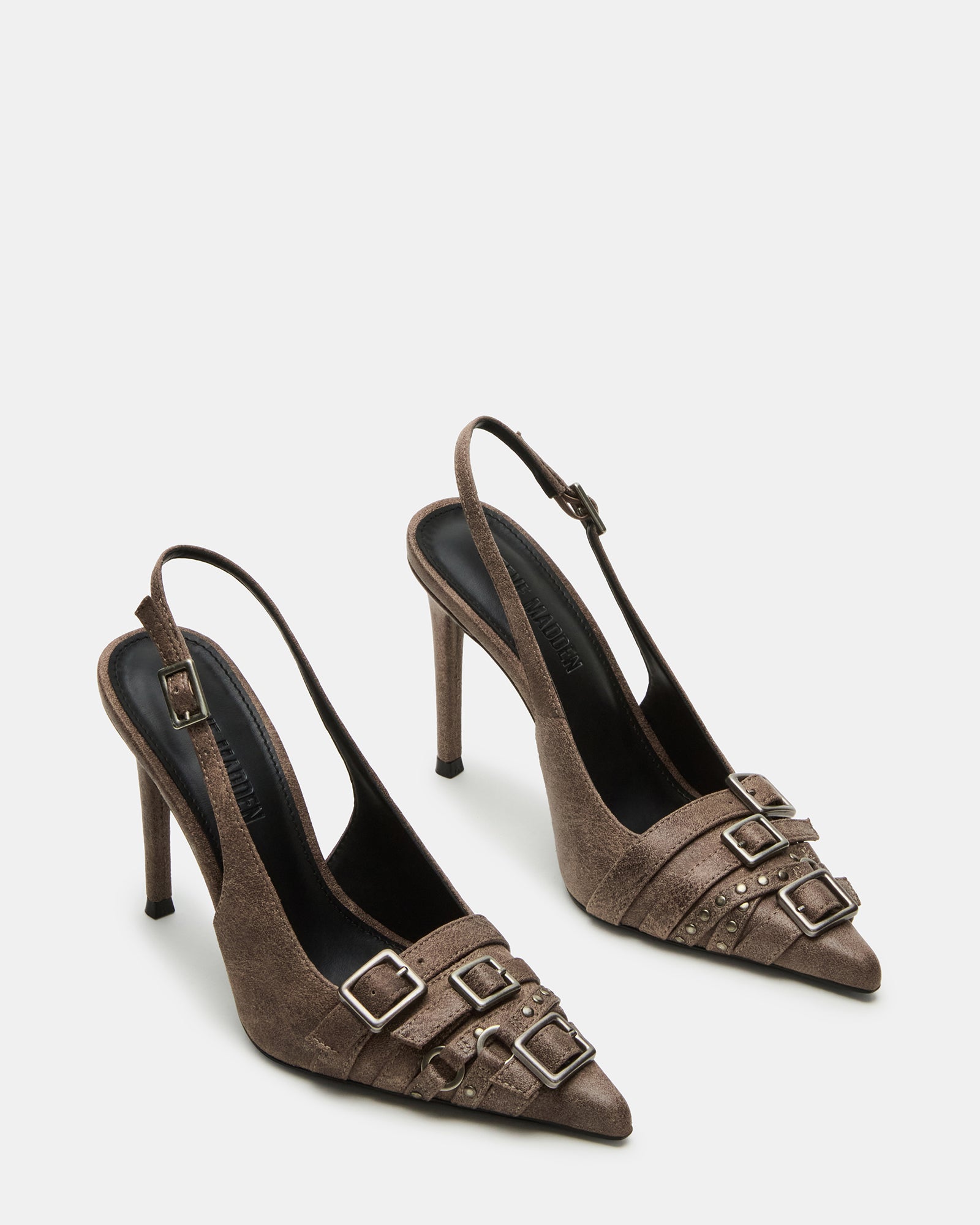 Side view of pointed-toe pumps highlighting sleek vegan leather material