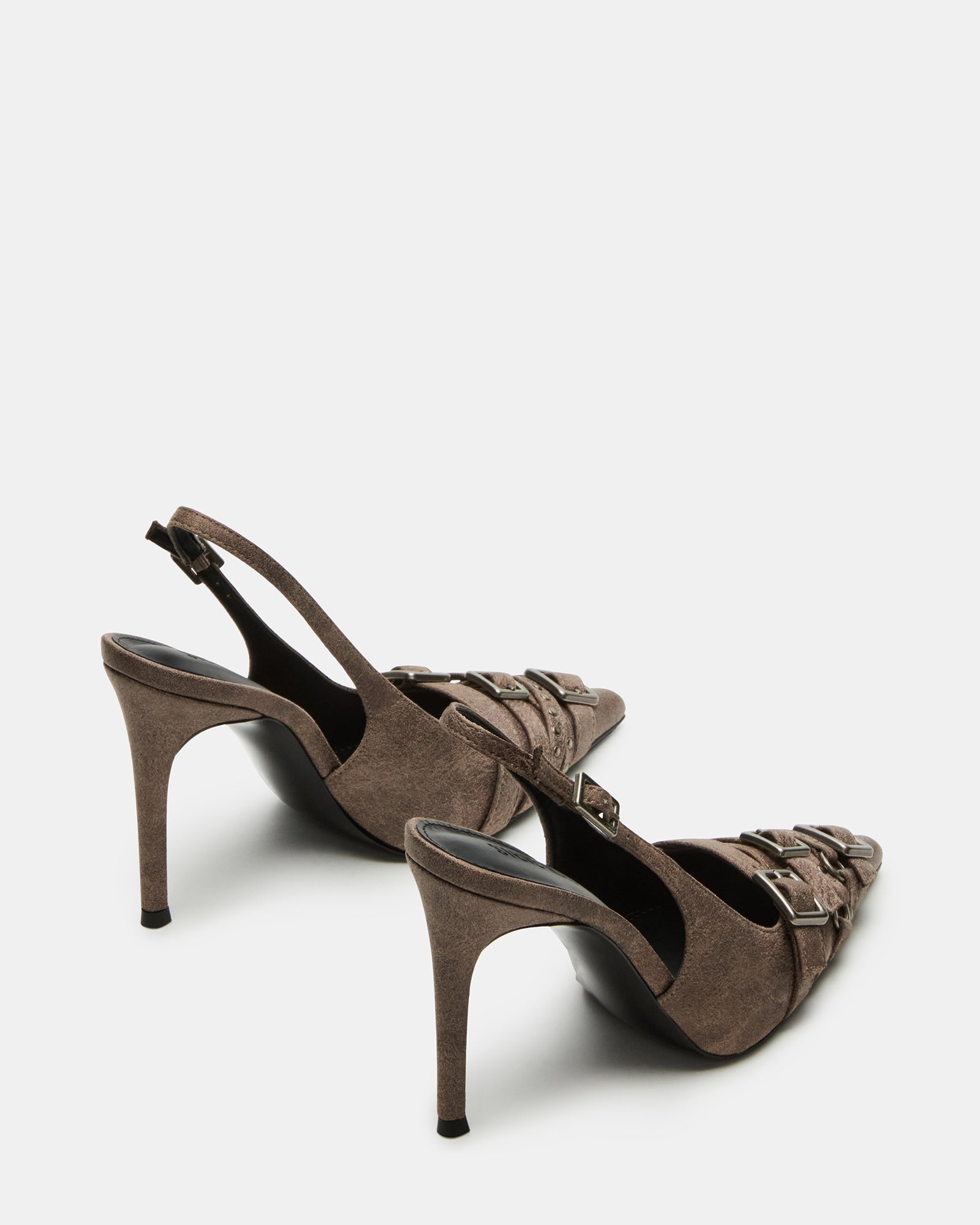 Side view of pointed-toe pumps highlighting sleek vegan leather material