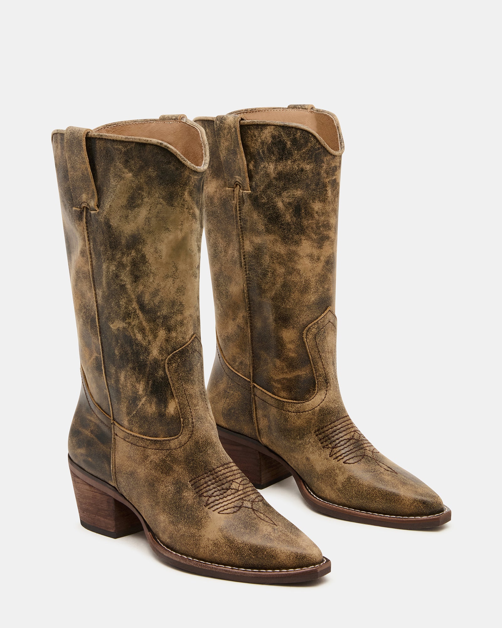 Front angle of knee-high boots with pointed toe and Western stitching.