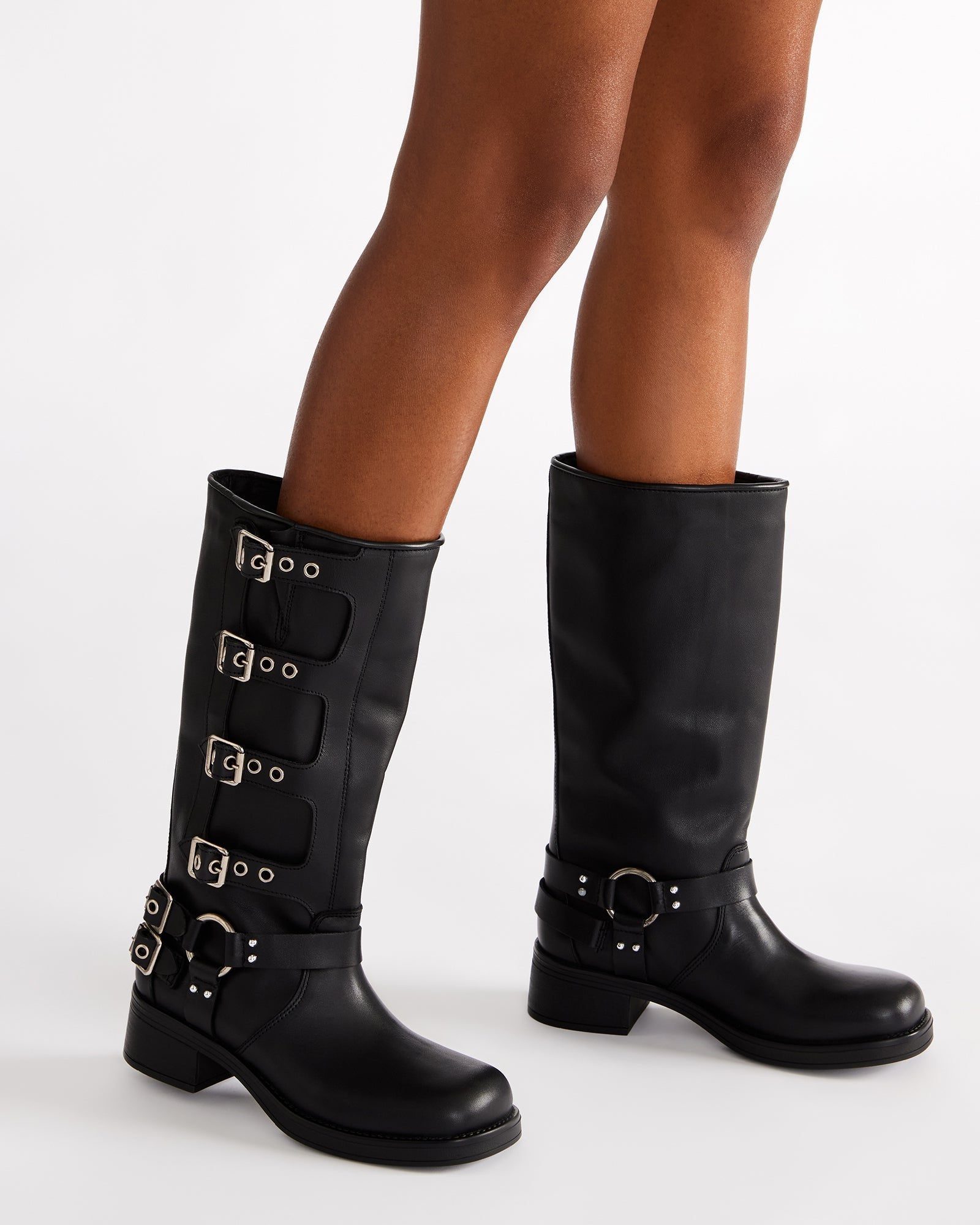 Front shot of black leather knee-high boots with adjustable straps