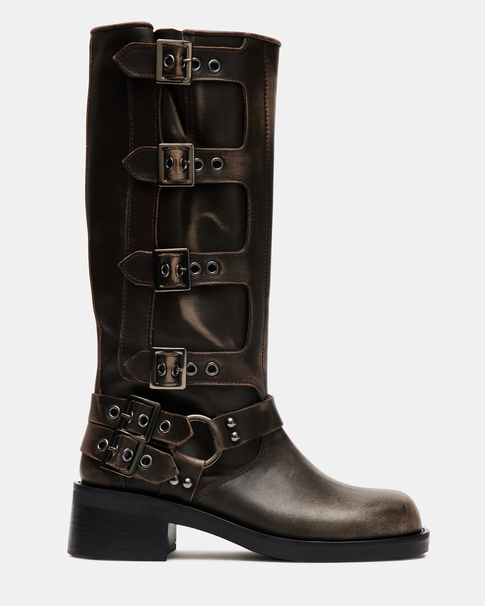 Close-up of distressed leather knee boots with buckle hardware and heel detail
