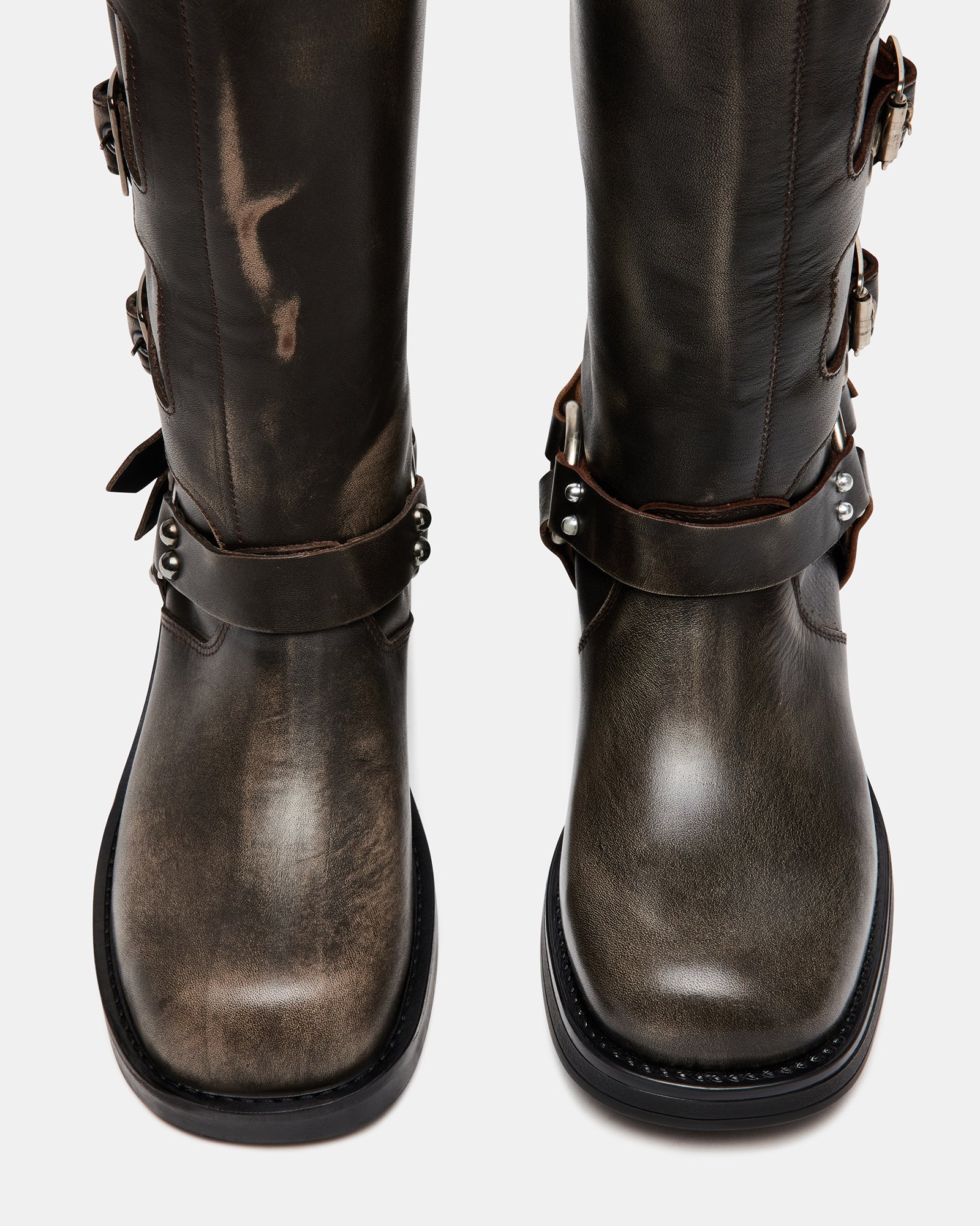 Side view of women’s knee boots with adjustable straps and rugged sole