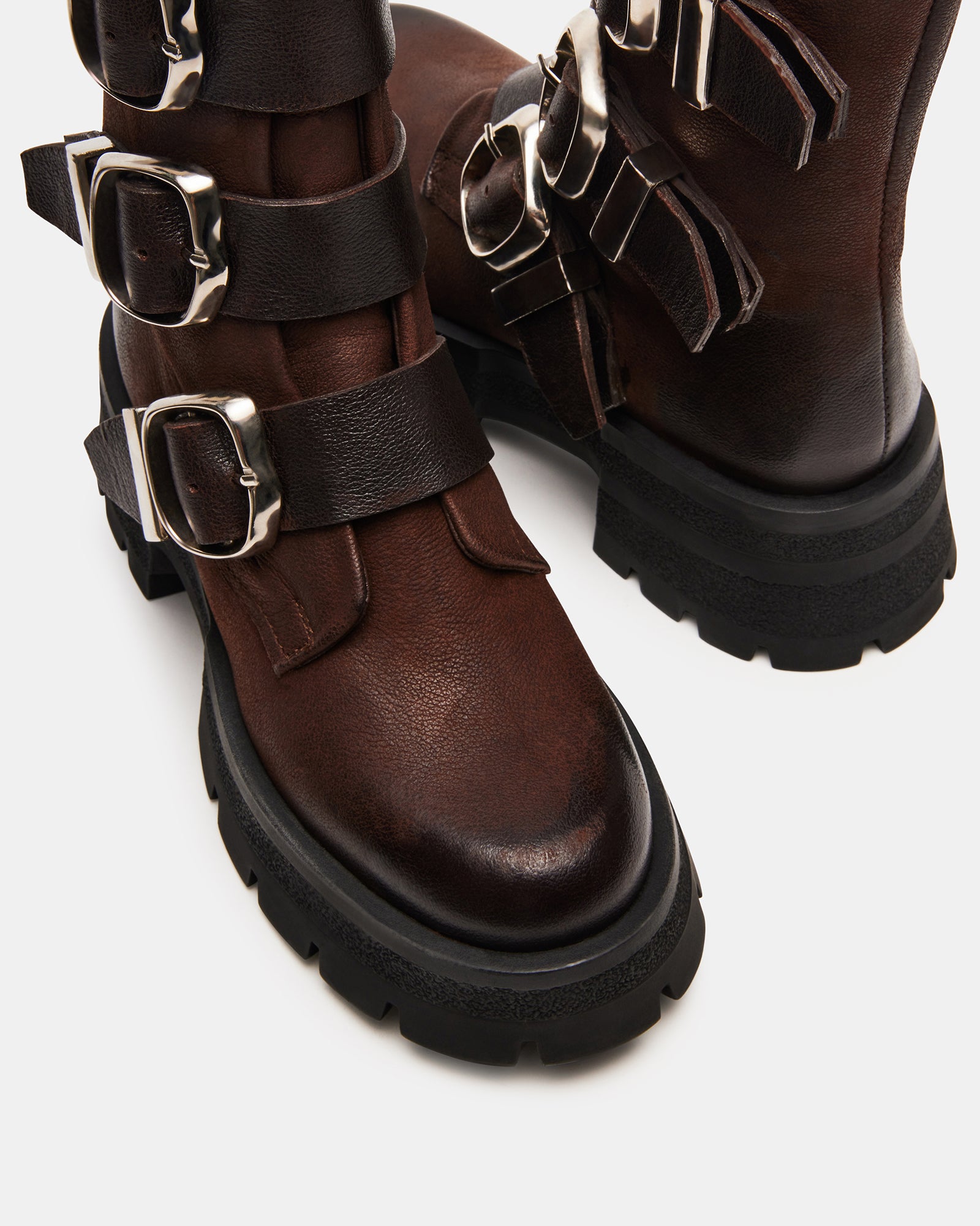 Close-up of the leather texture and stitching on the boots