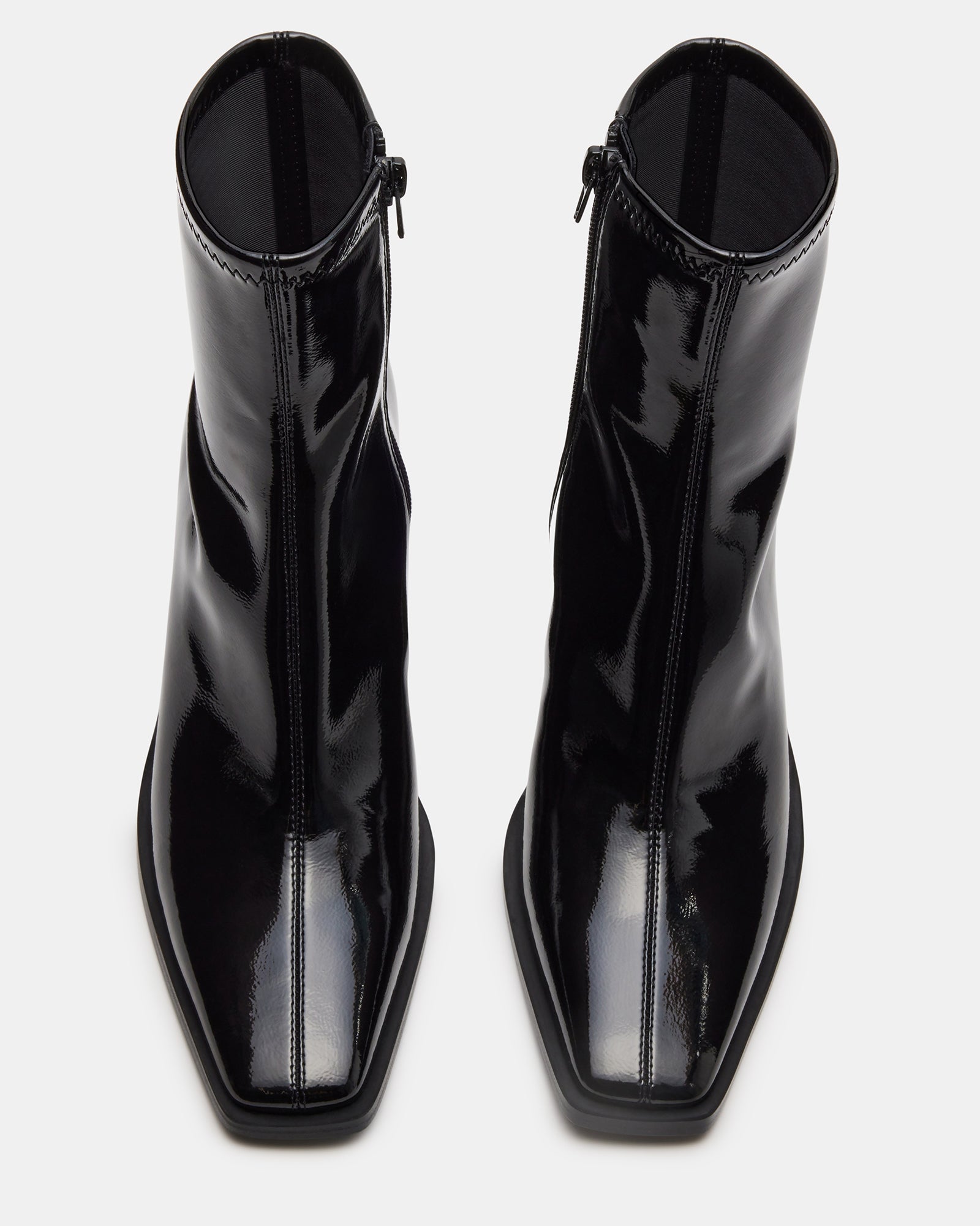 Side view of black leather ankle boots with square toe and block heel
