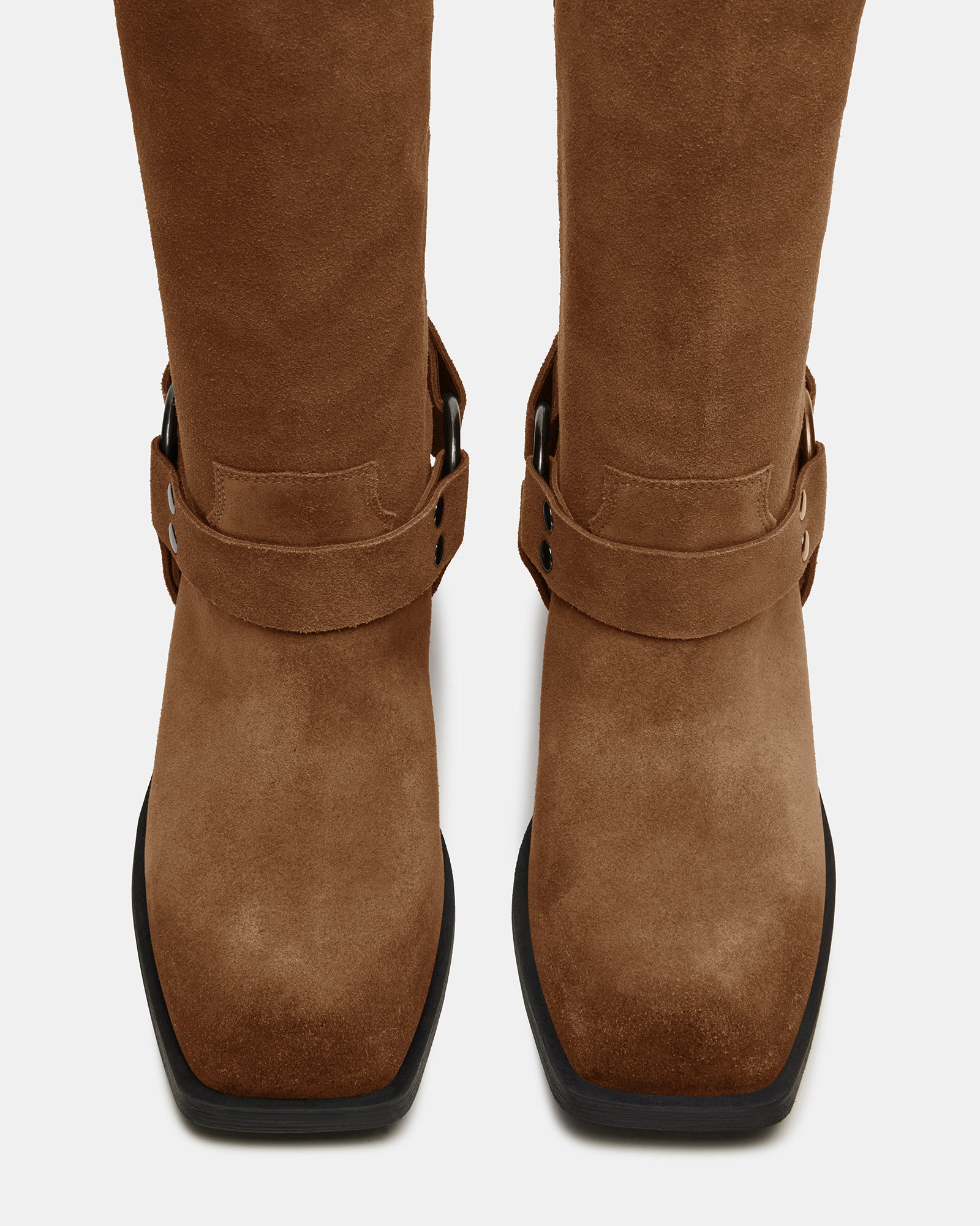 Brown suede boots paired with denim for casual wear