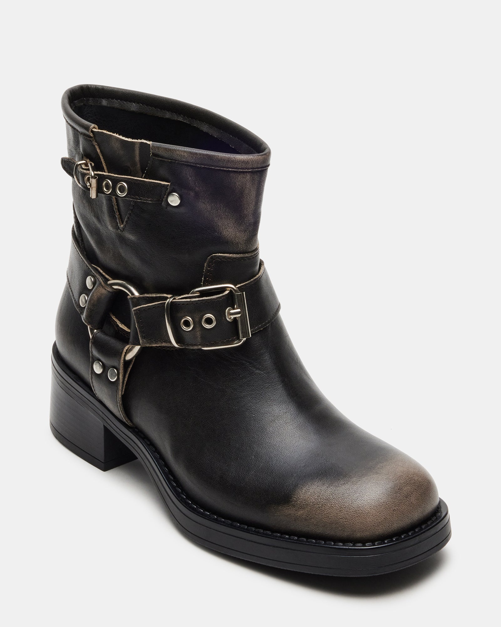 Close-up of square toe and distressed leather detailing.