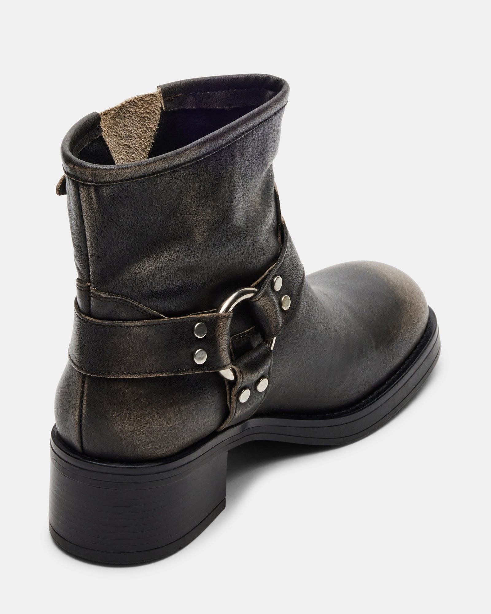 Close-up of square toe and distressed leather detailing.