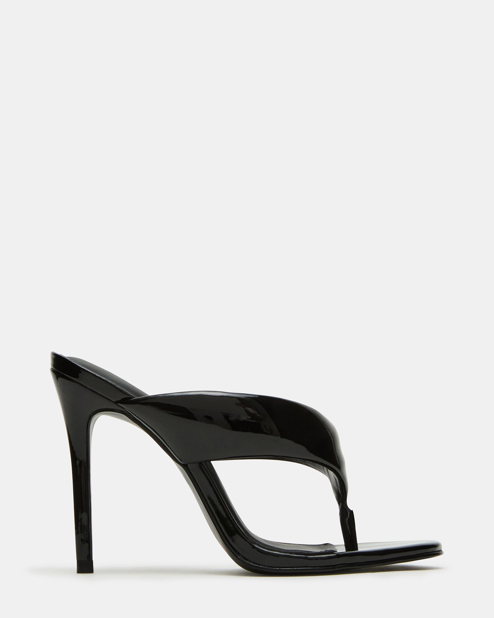 Sabine thong heeled sandals styled with jeans and a blazer for a polished look.