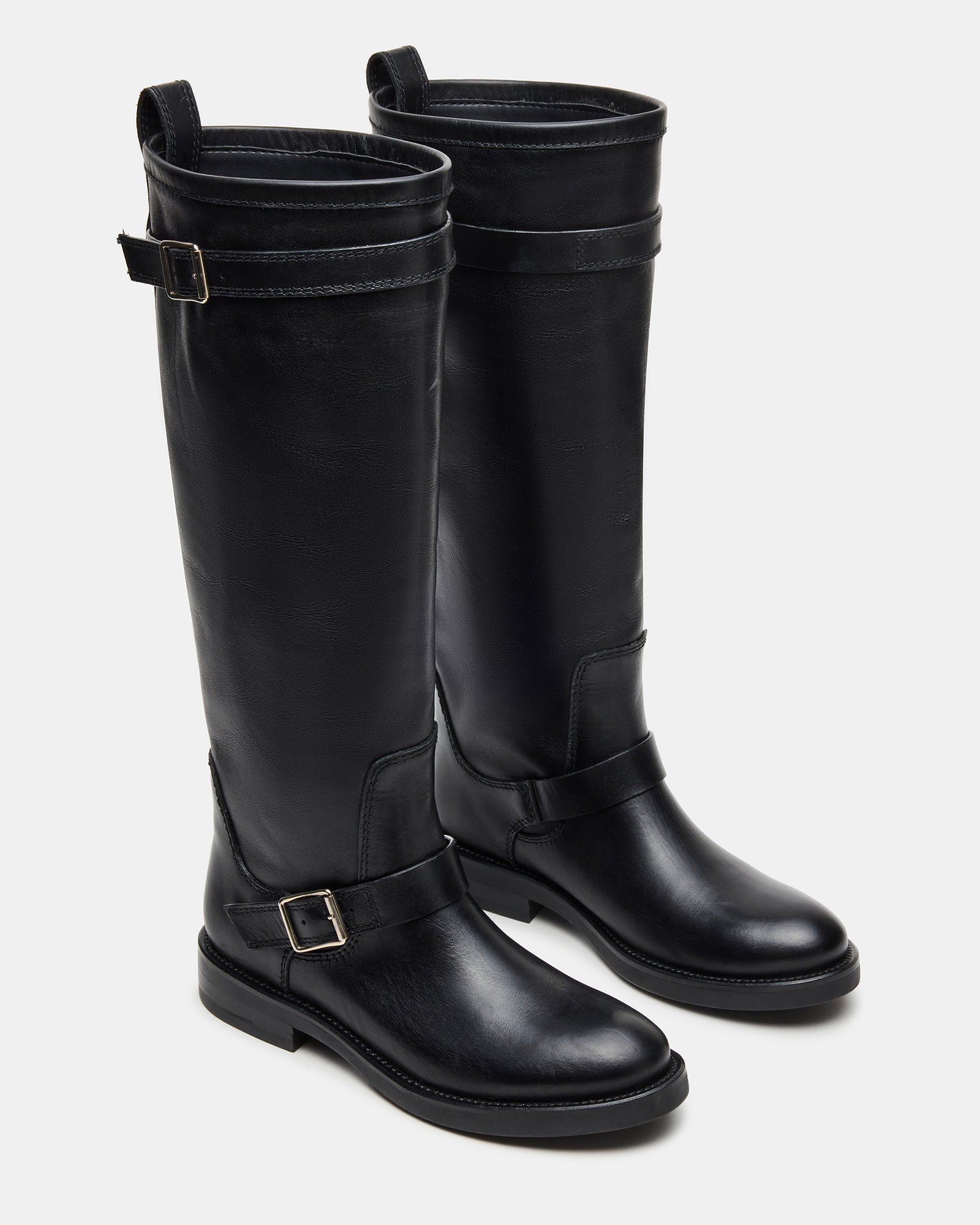 Black leather boots styled with jeans, ideal for city wear