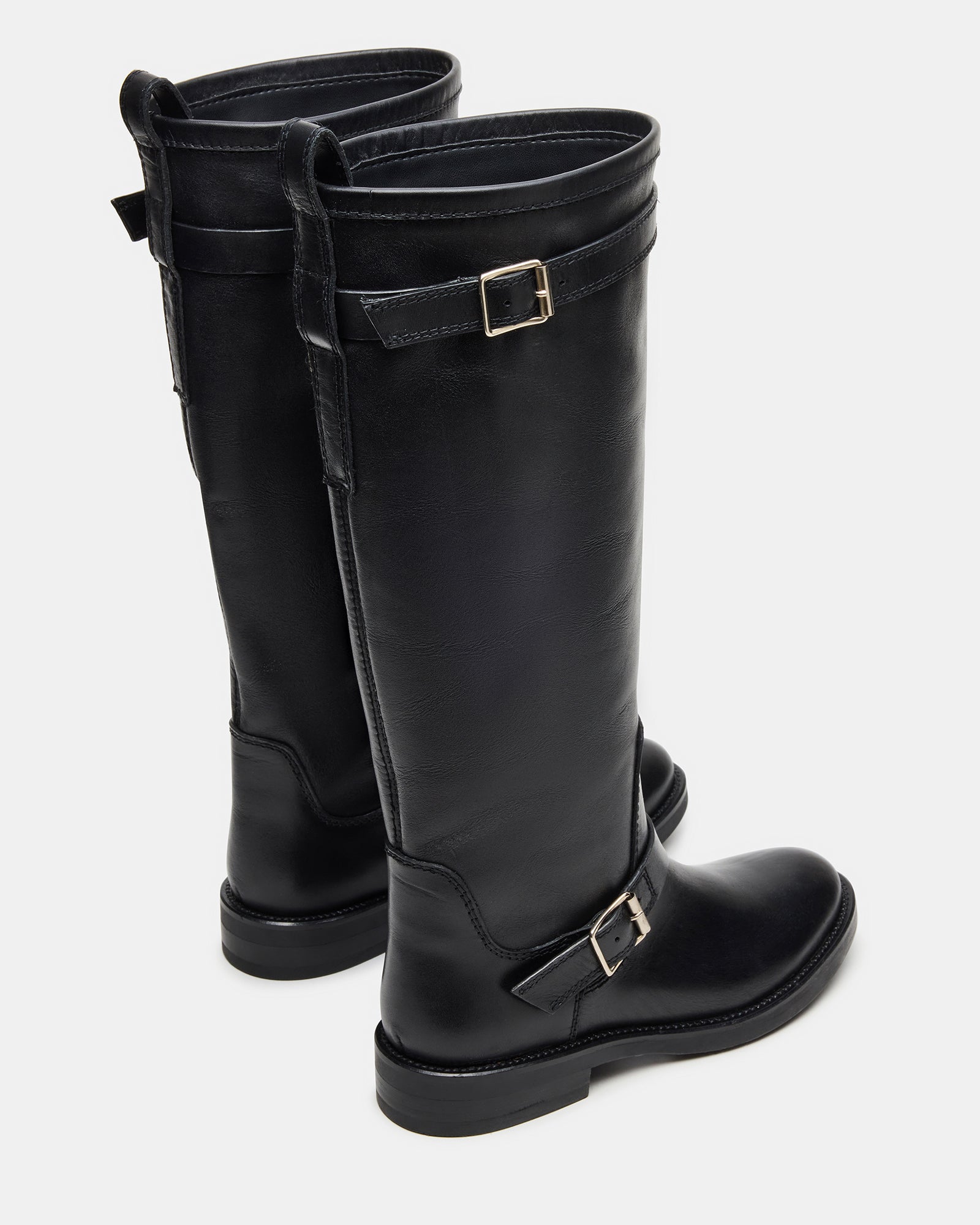 Black leather boots styled with jeans, ideal for city wear