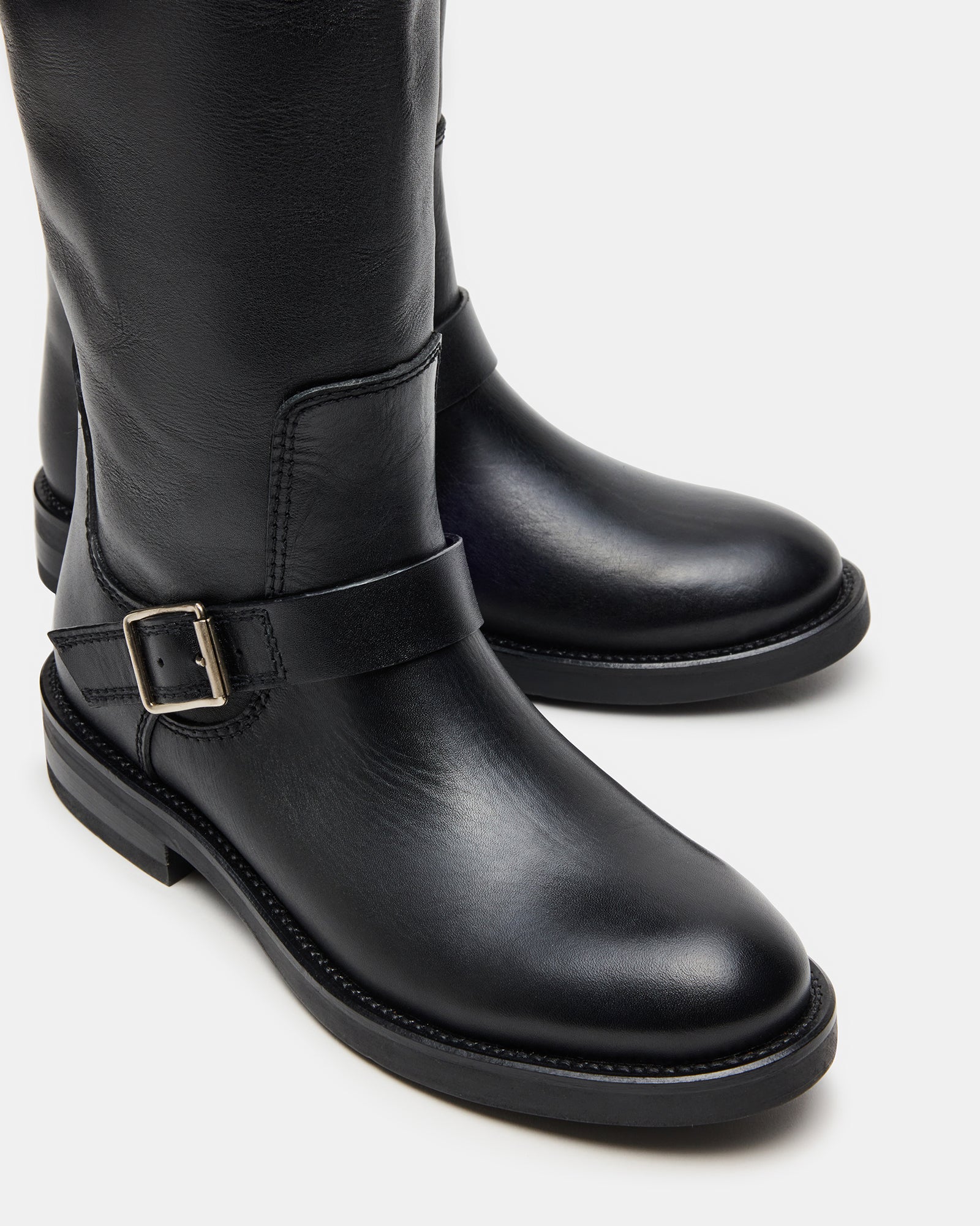 Close-up of boot toe and heel showing leather texture and fit