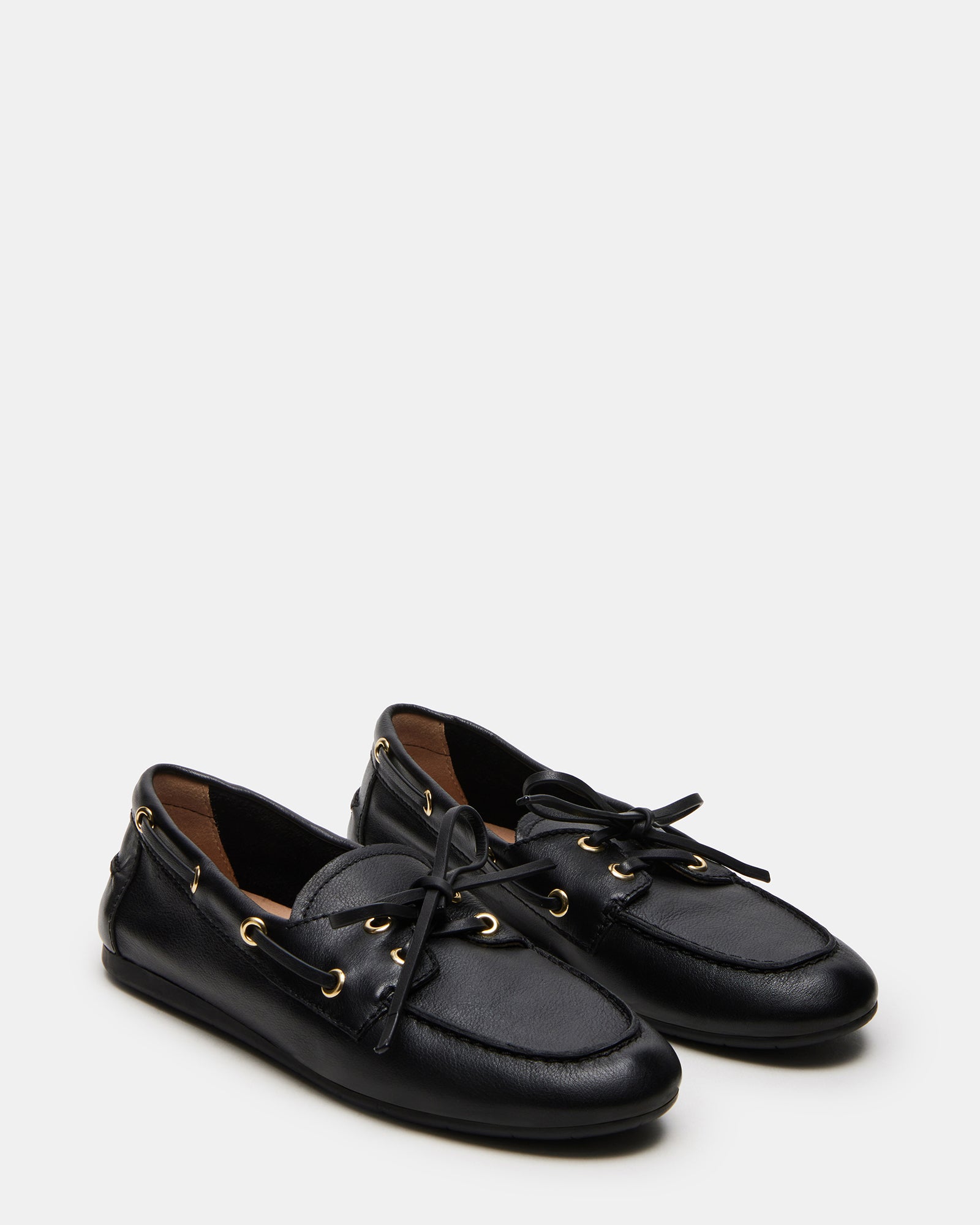 Close-up of black leather loafers showcasing the fine craftsmanship