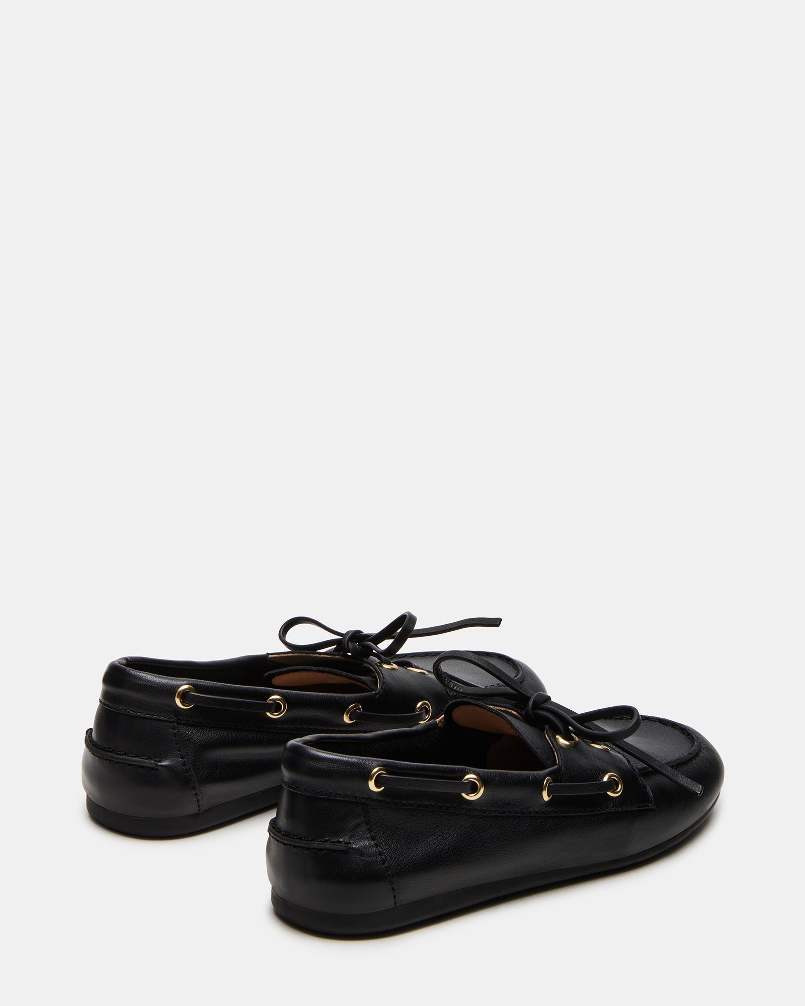 Close-up of black leather loafers showcasing the fine craftsmanship