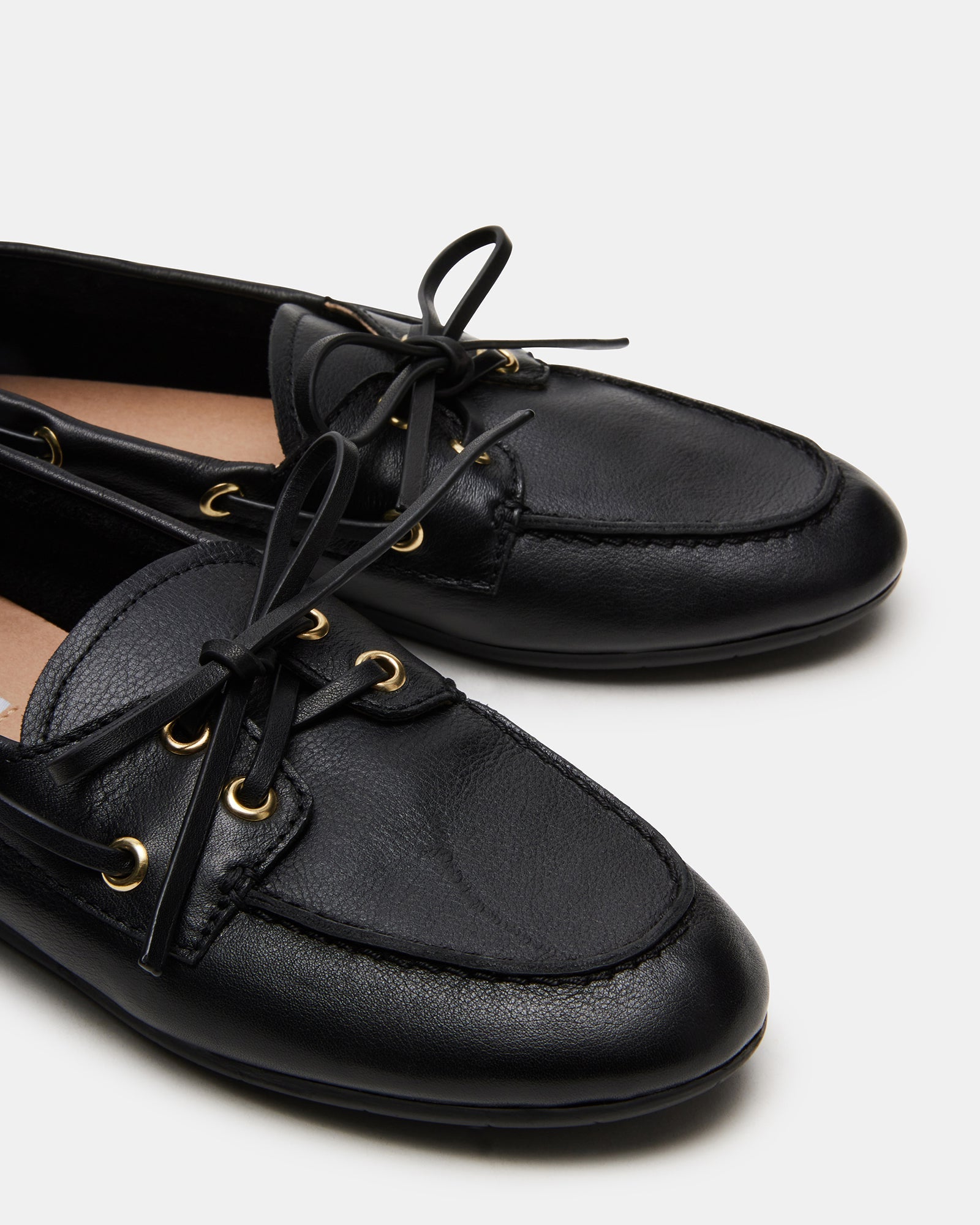 Wearing black leather loafers with casual jeans for a stylish look