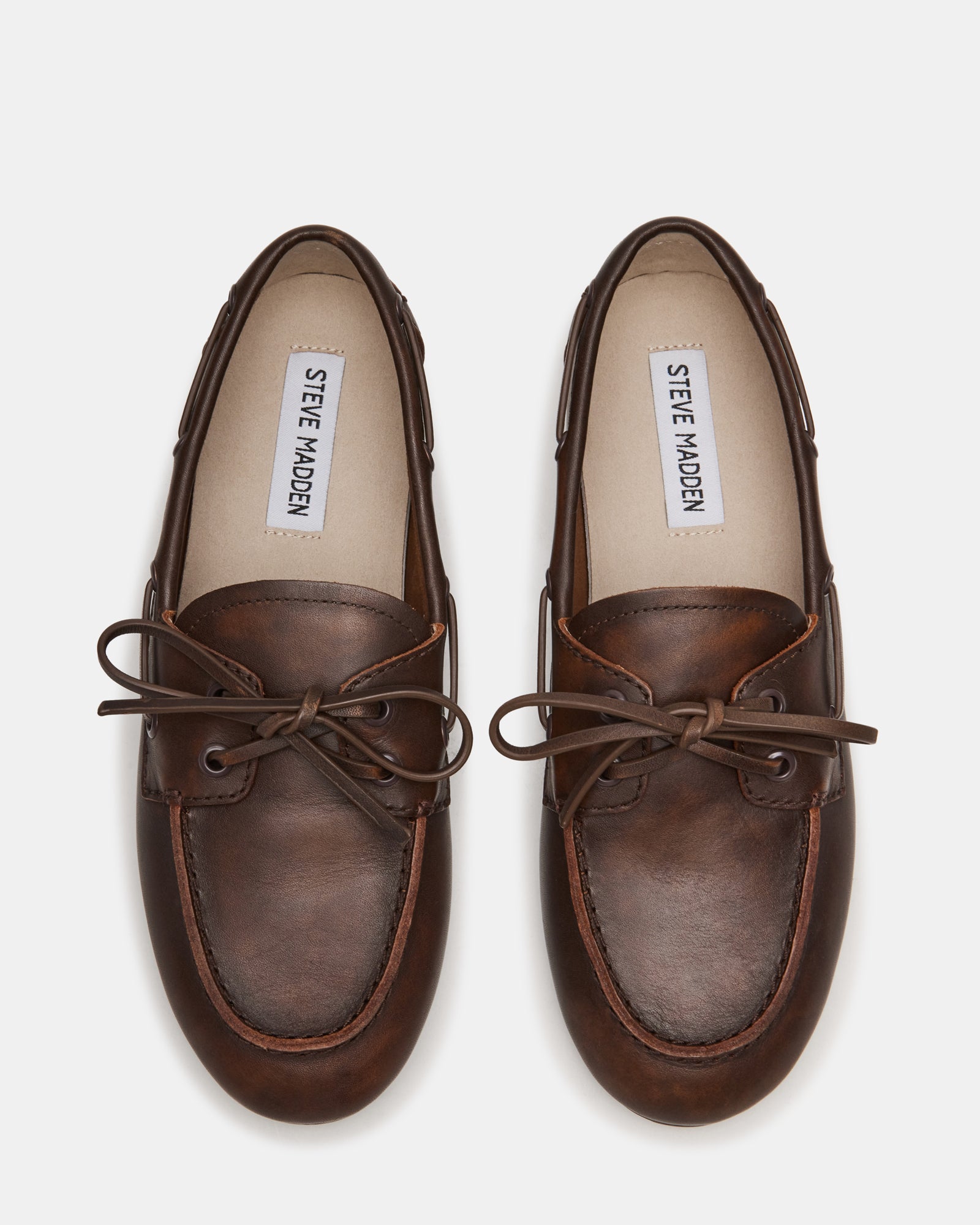 Close-up of SAG loafers showing the rich brown leather texture and microfiber lining.