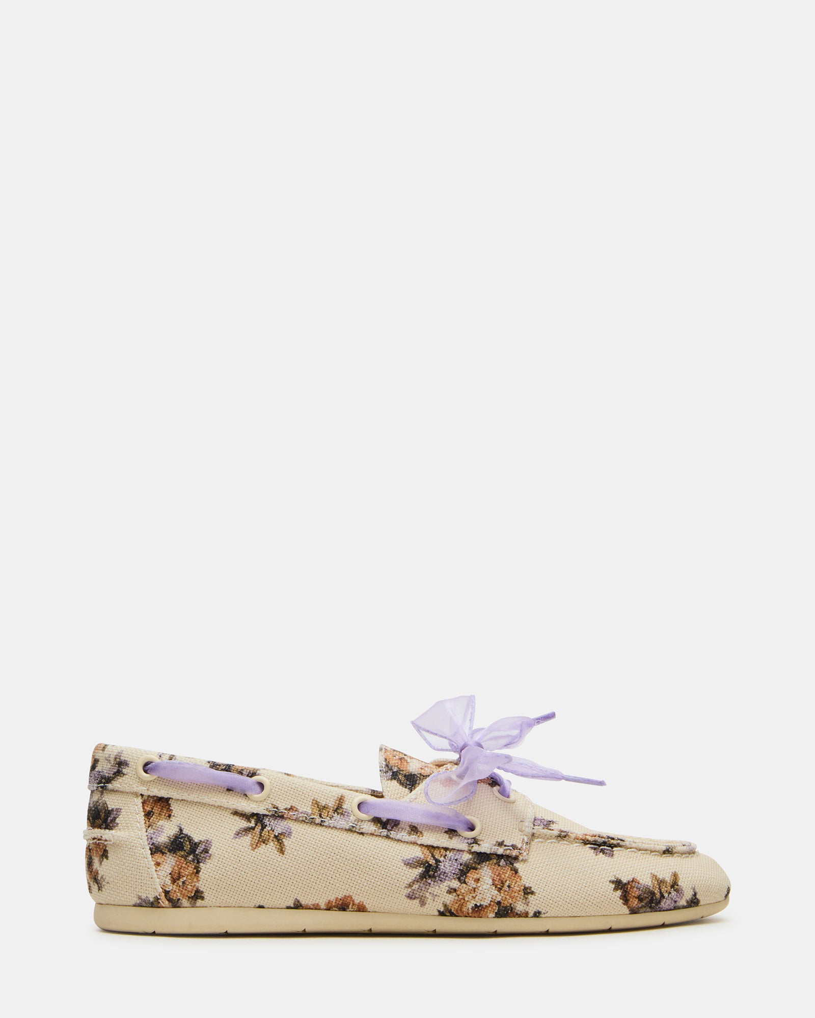 SAG Floral Loafers paired with slim-fit trousers for a polished look