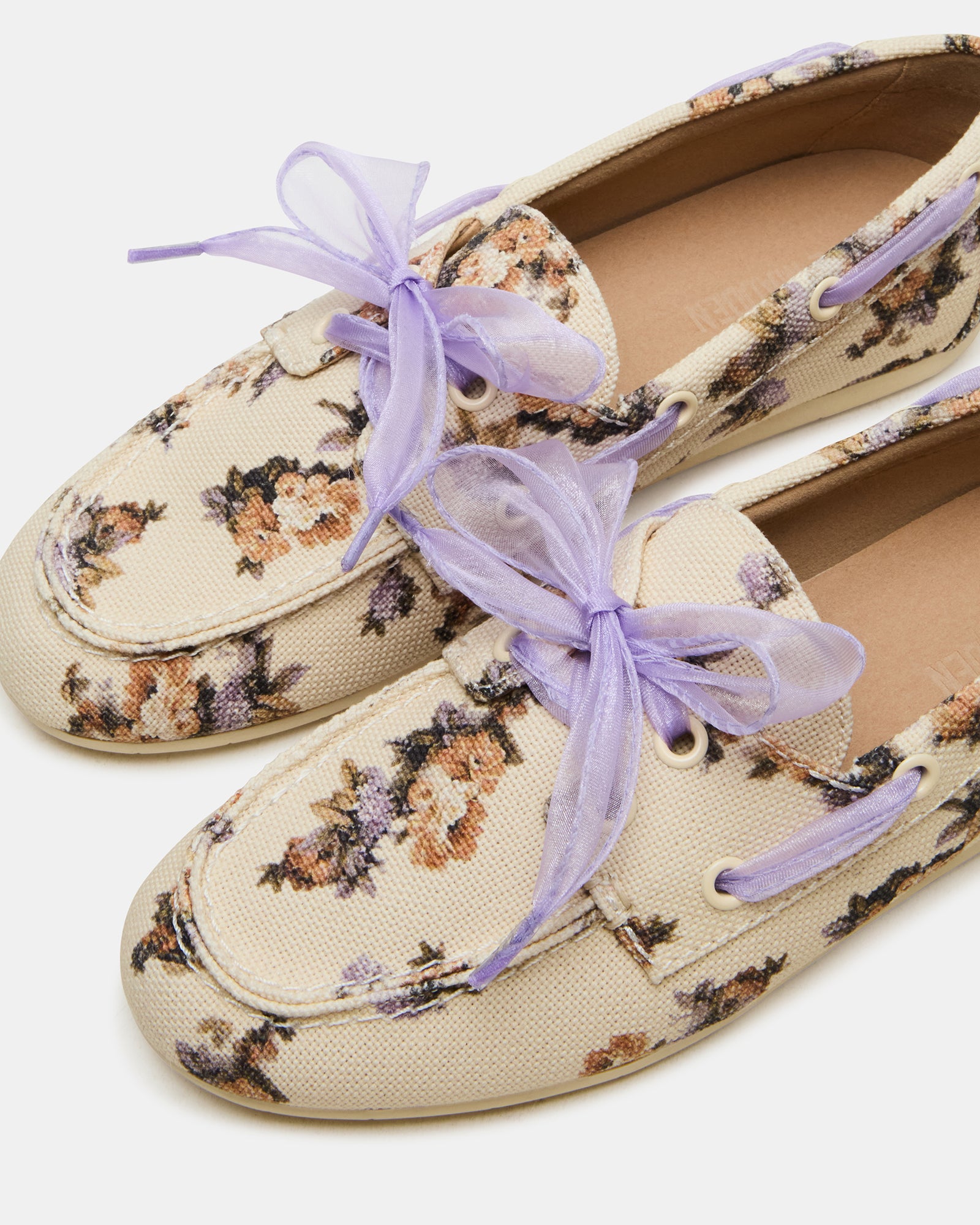 Side profile showcasing the .25-inch heel and floral detailing