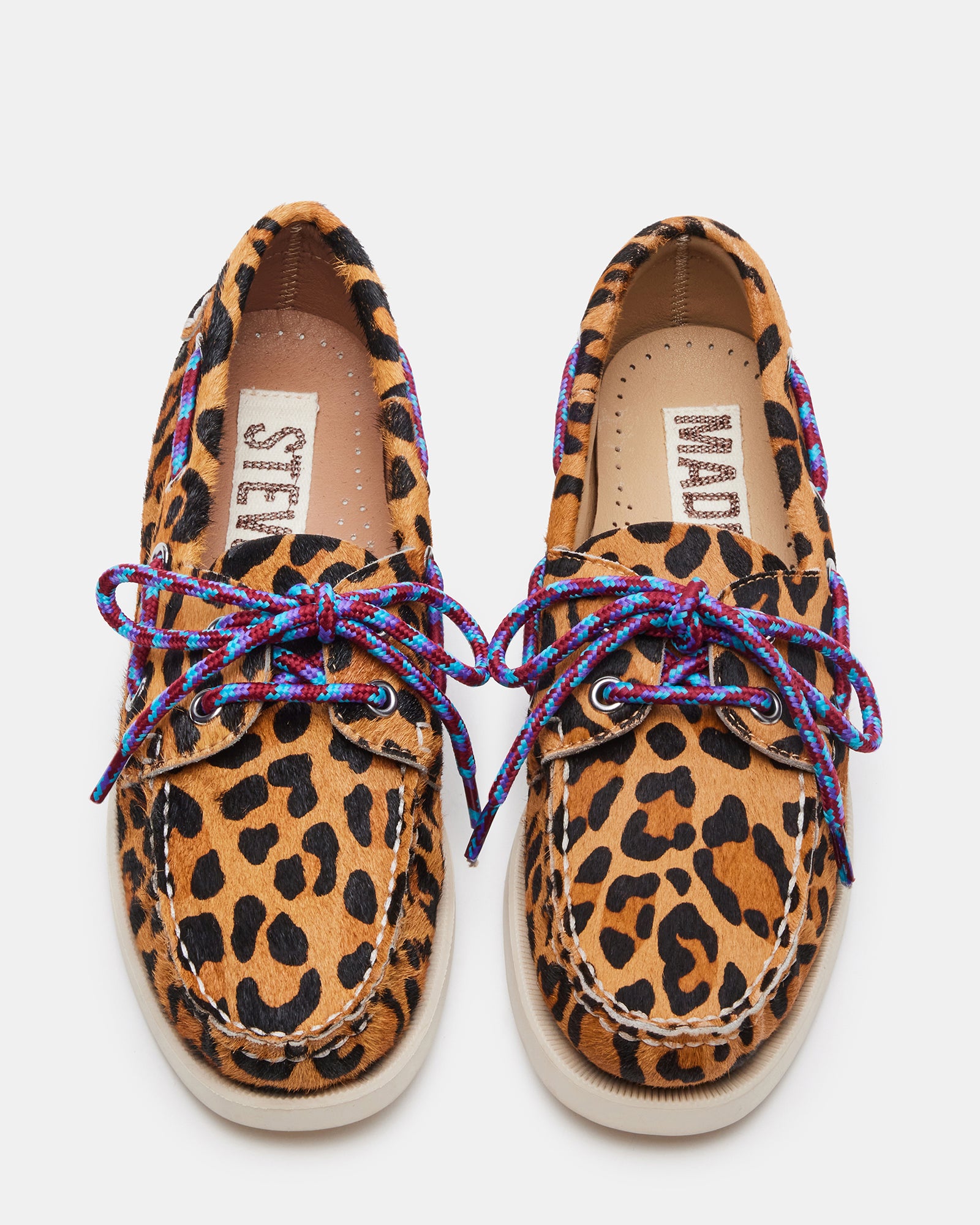 Close-up of boat shoes showing rounded toe and bow, styled for daily wear