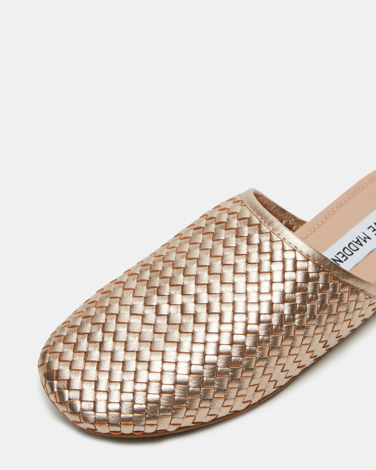 Brown leather flats paired with a handbag for a polished look.