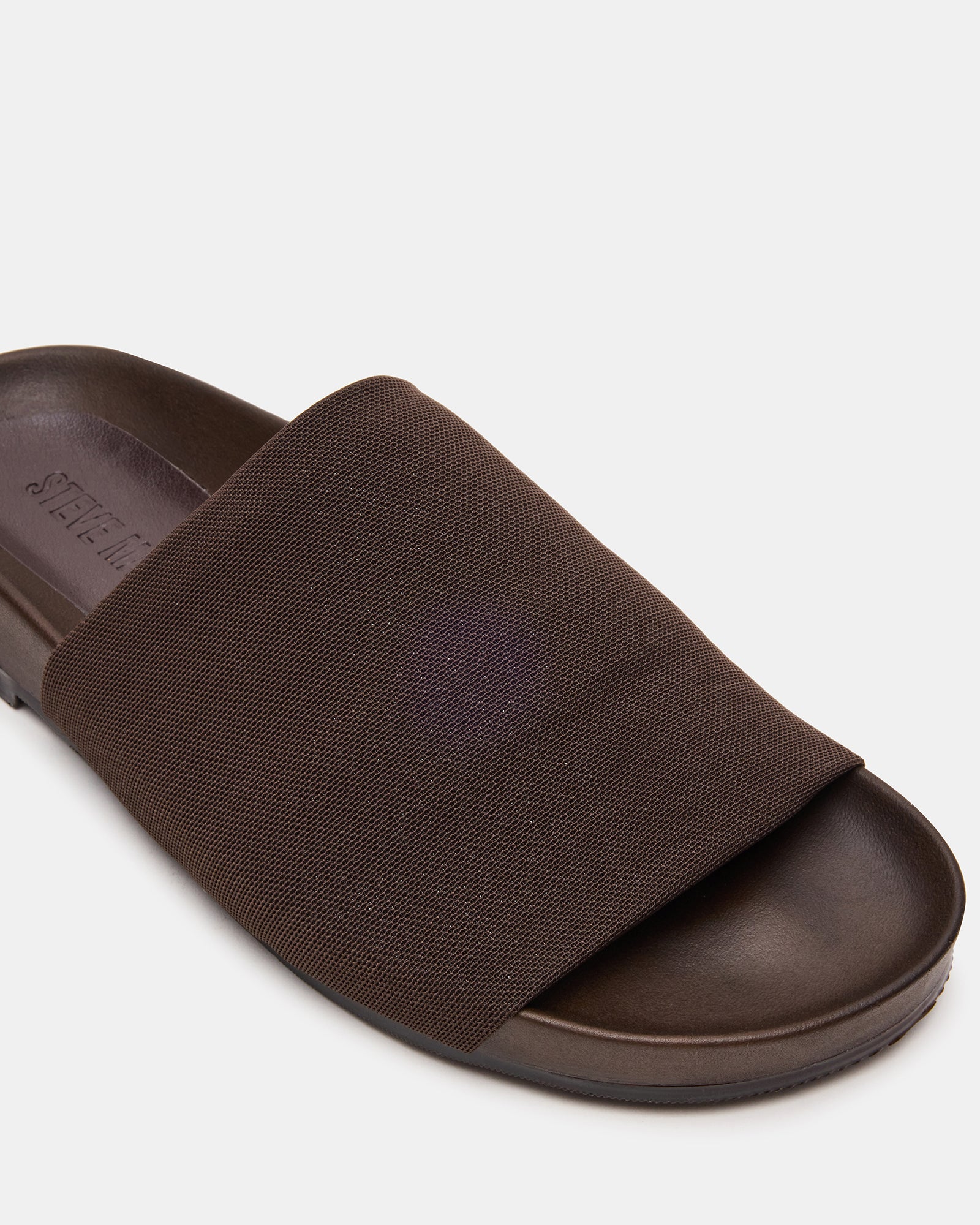 Sansa flatform slide sandals worn casually with summer attire, highlighting their comfort and versatility.